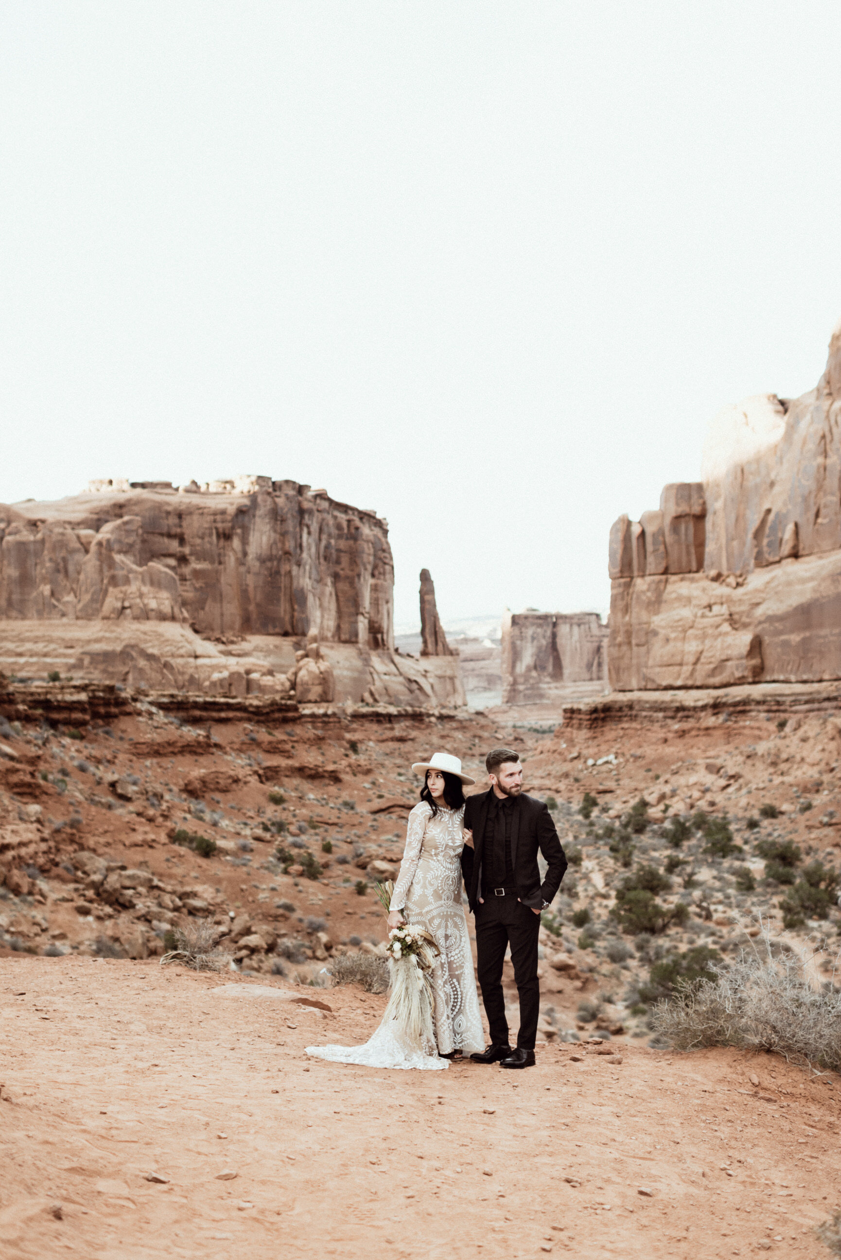 wedding couple in moab utah canyon