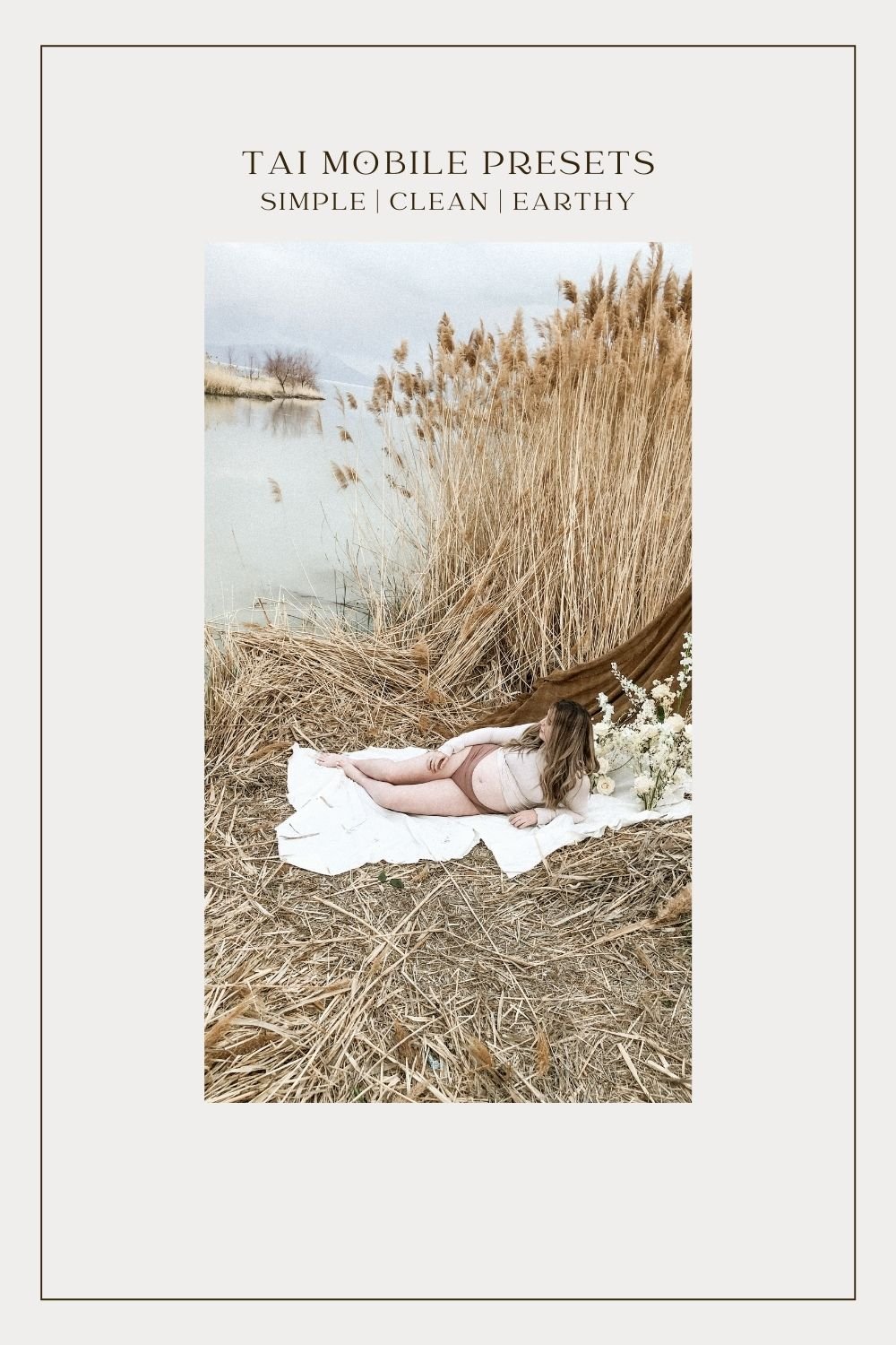 pregnant mom on grassy beach next to lake