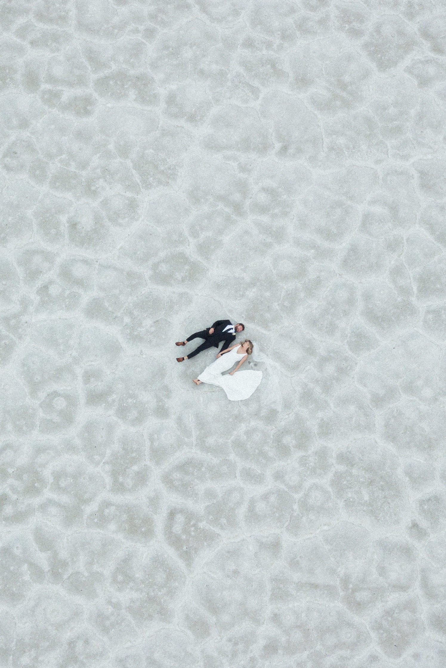 drone view wedding couple on salt flats