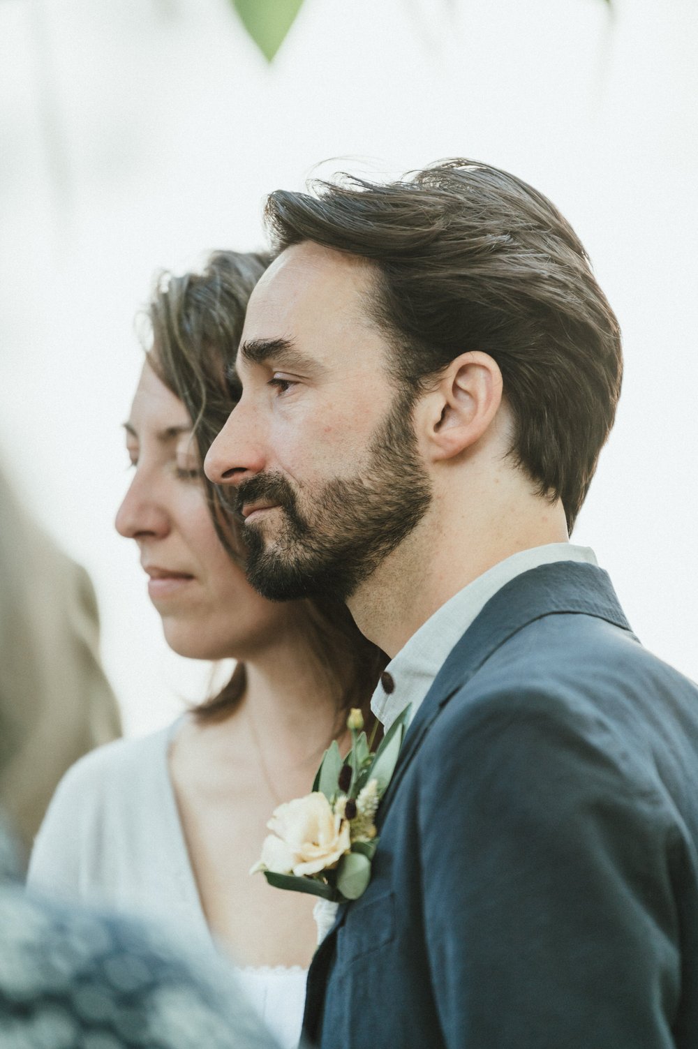emotive photo of bride and groom profiles close up together