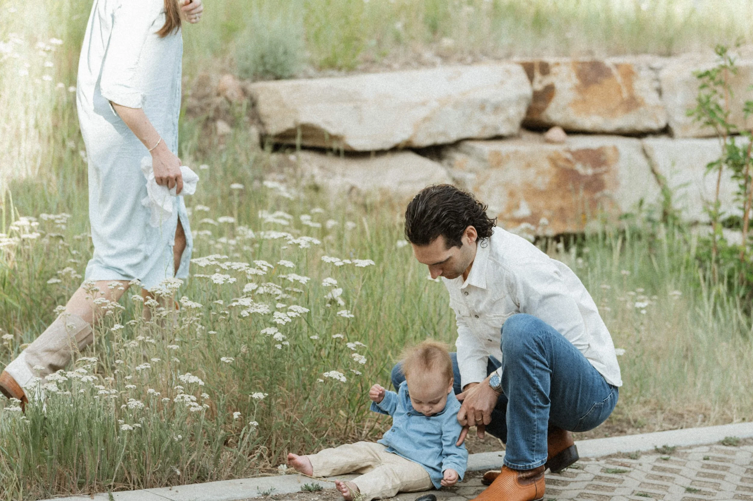 family photo outdoors in flowers at the lodge at blue sky park city utah