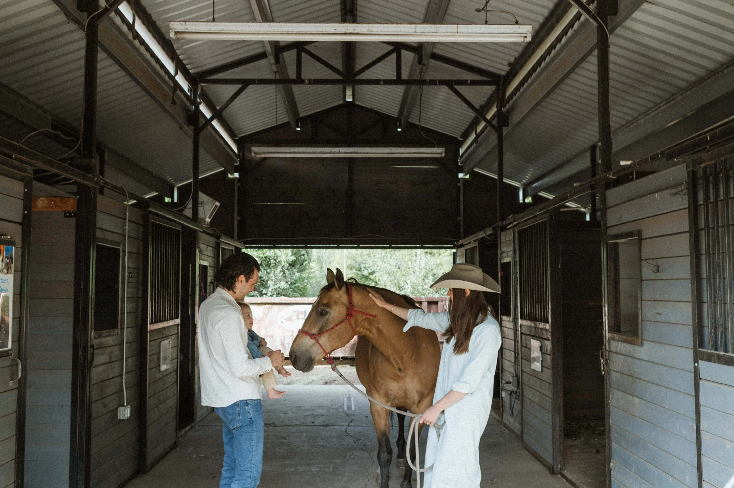 family photo with horses and barn at the lodge at blue sky park city utah