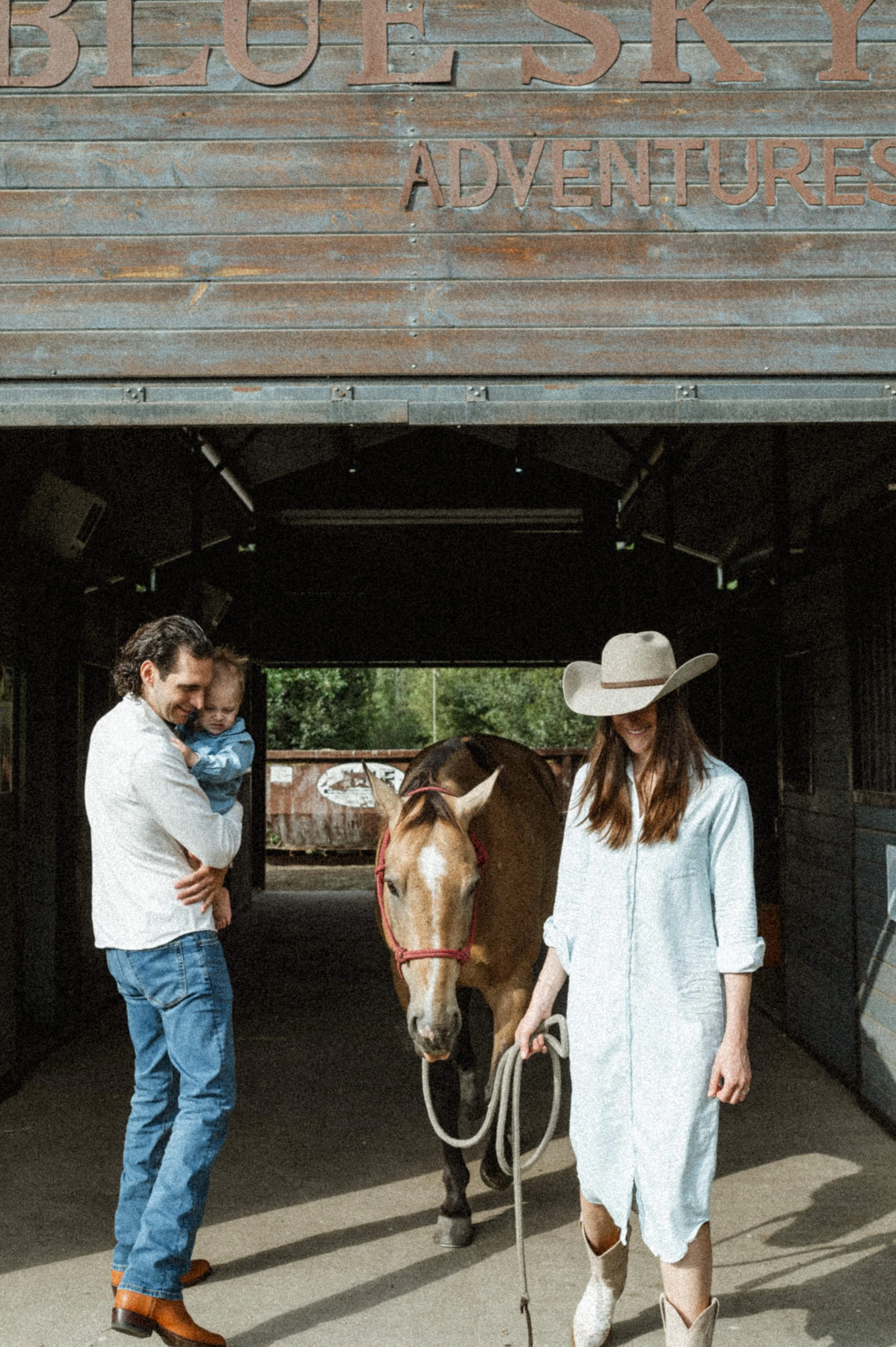 family photo with horses and barn at the lodge at blue sky park city utah