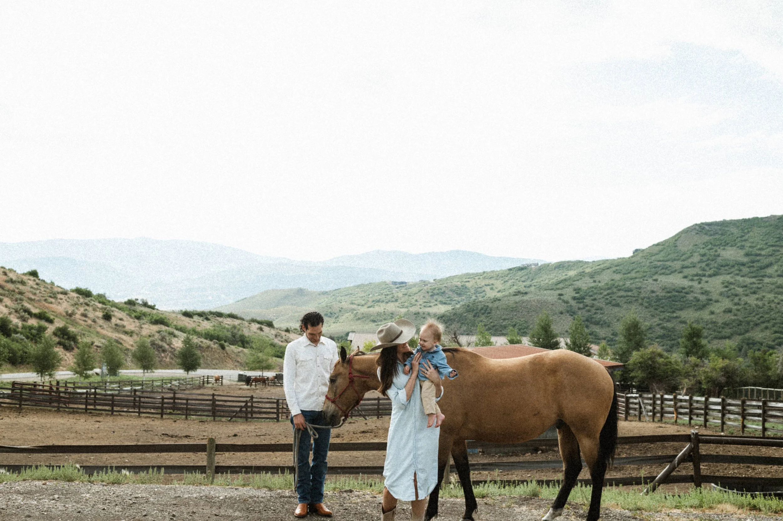 family photo with horses and barn at the lodge at blue sky park city utah