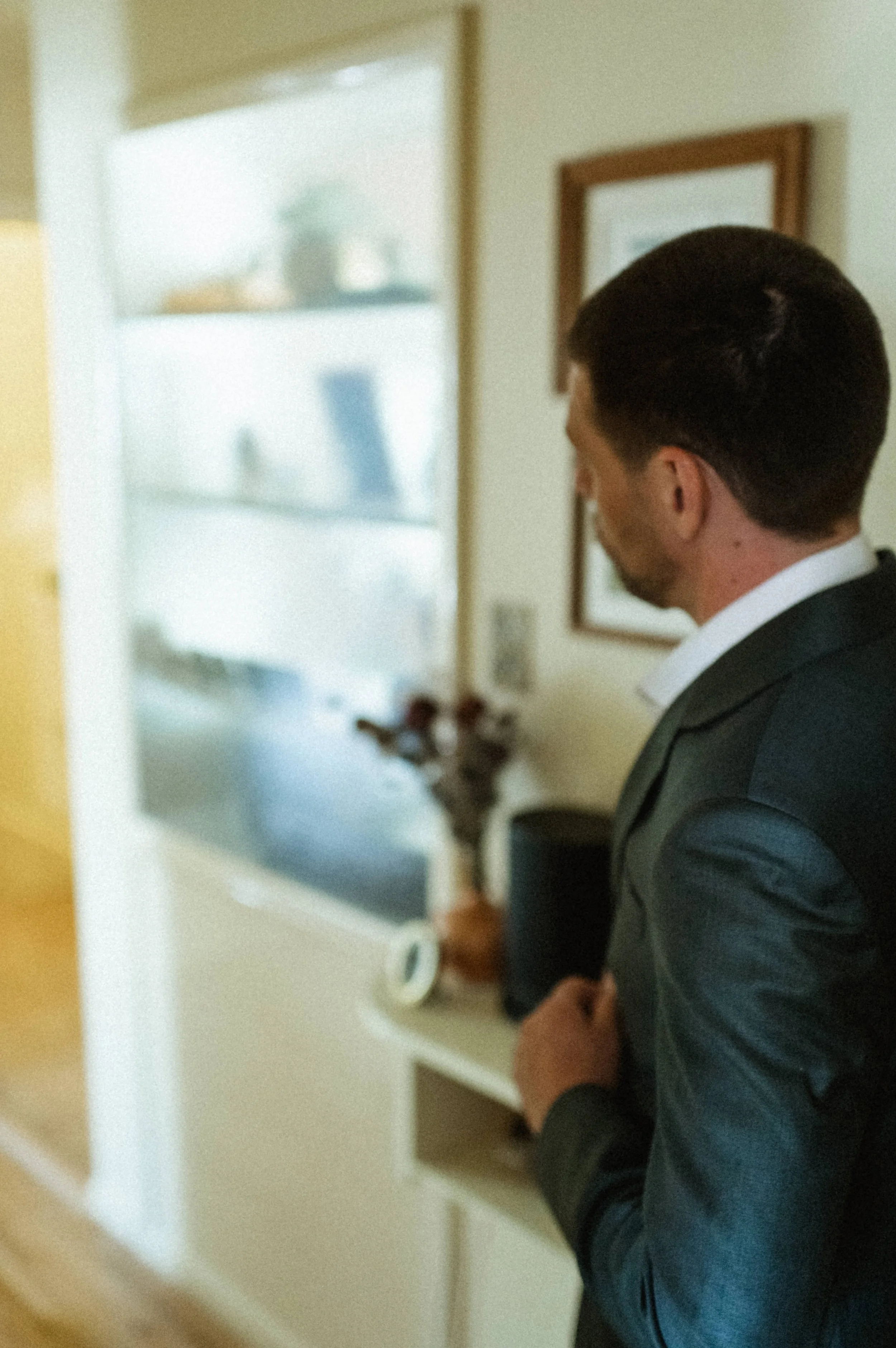 Groom getting ready in artsy, eclectic home ahead of downtown Salt Lake City wedding