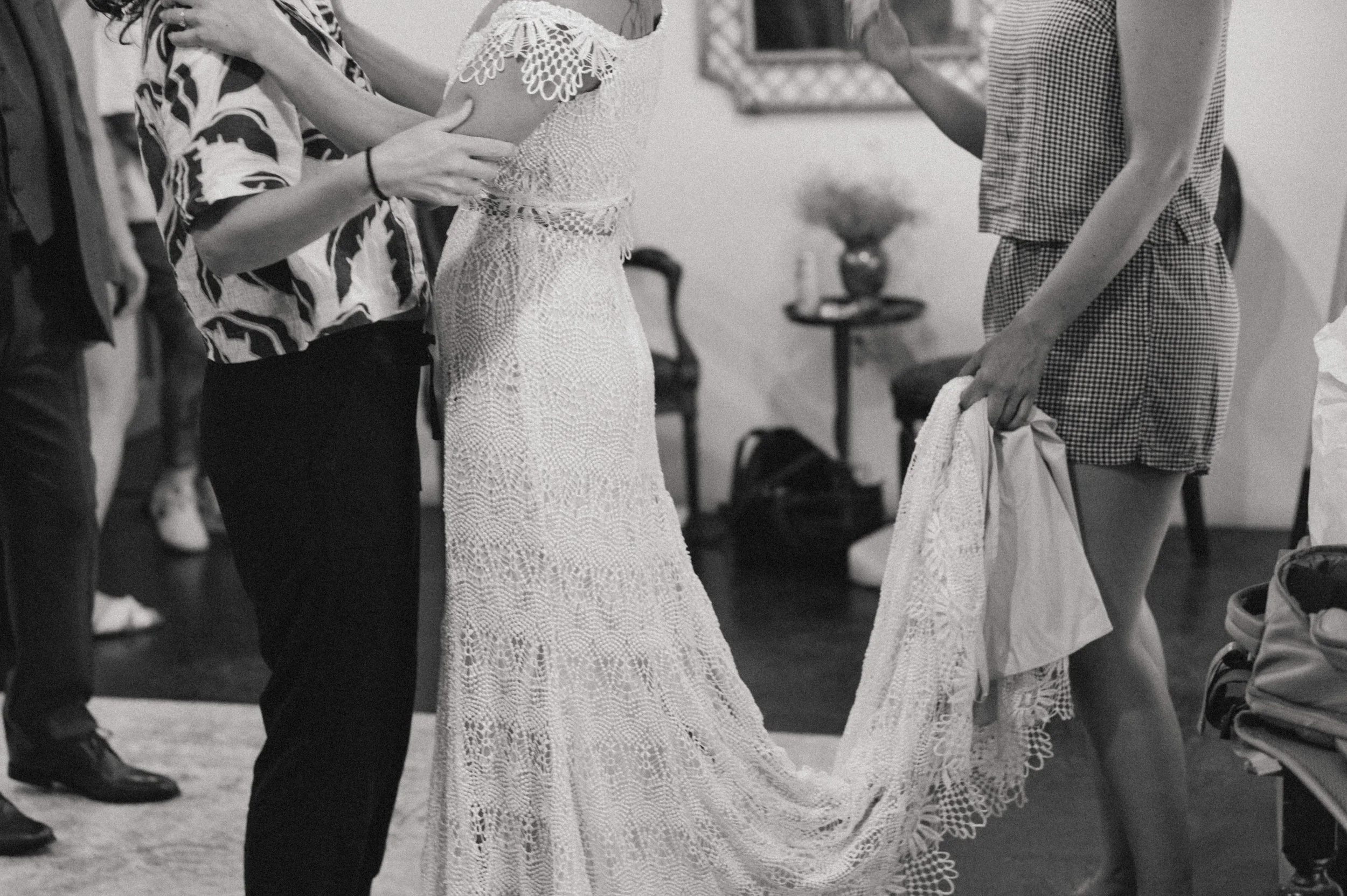 Bride in two-piece lace wedding dress with peek-a-boo waist at Ember wedding venue, Salt Lake City