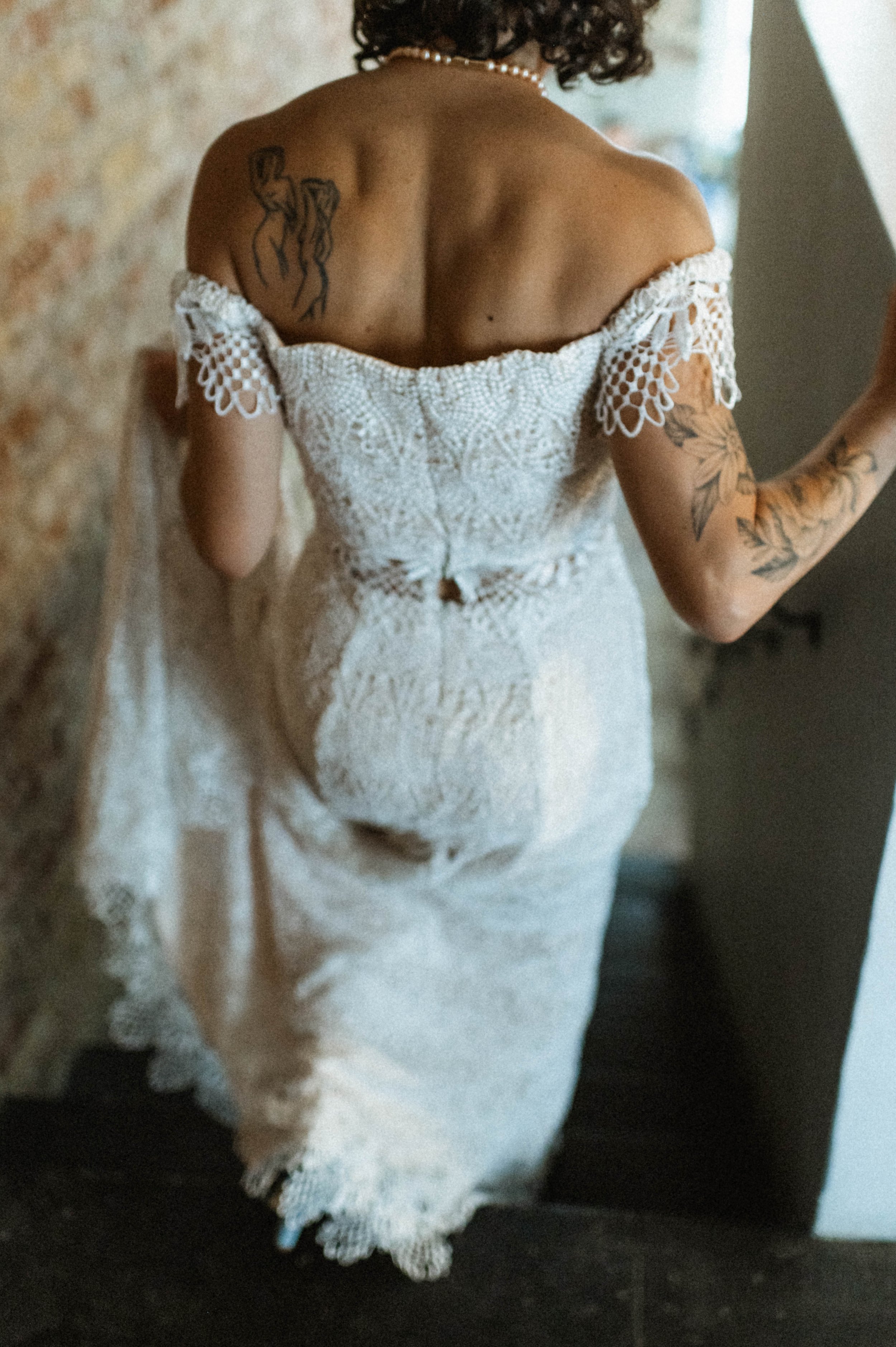 Bride in two-piece lace wedding dress with peek-a-boo waist at Ember wedding venue, Salt Lake City