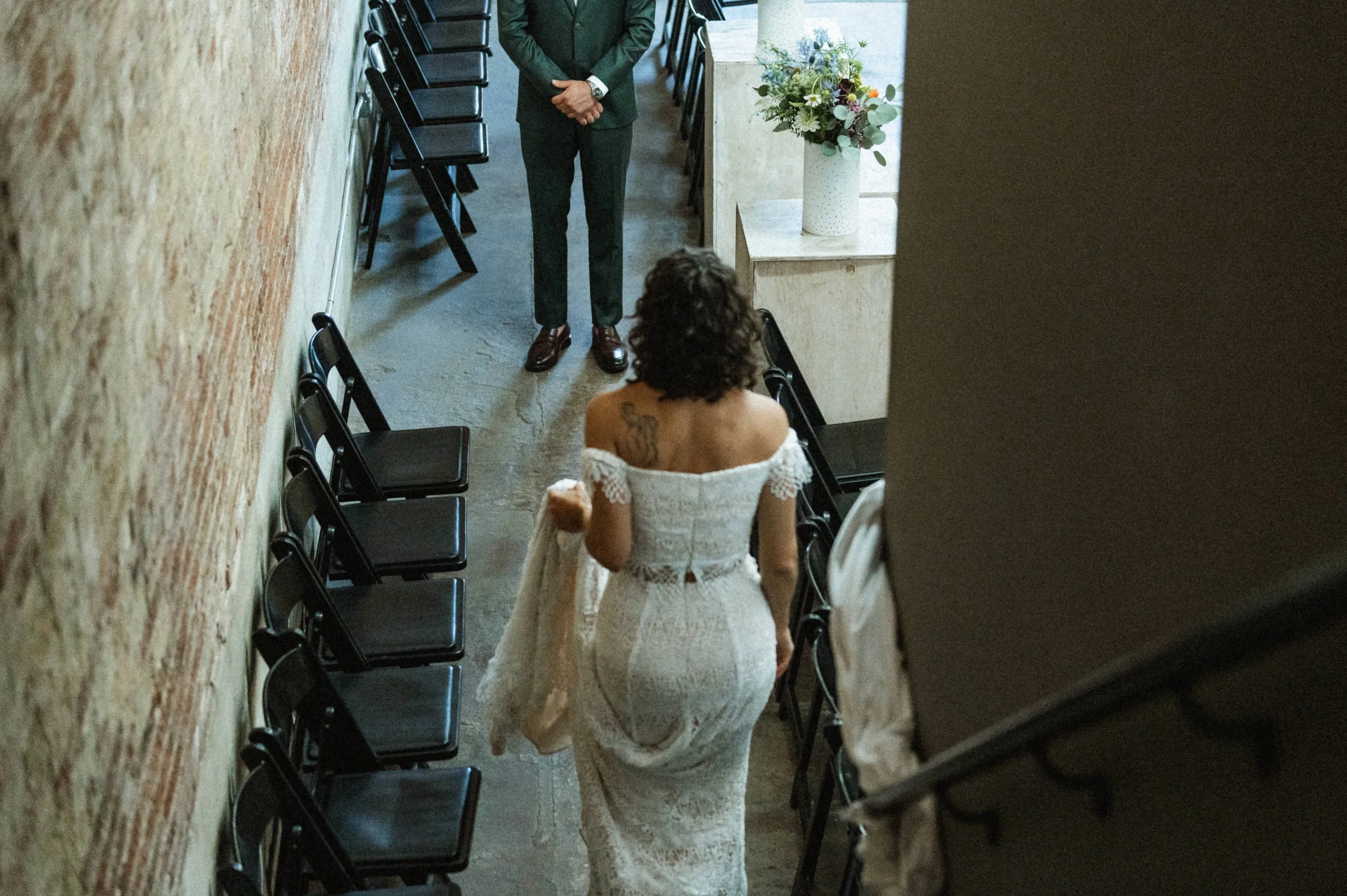 Bride and groom portrait against industrial brick backdrop at Ember, downtown Salt Lake City