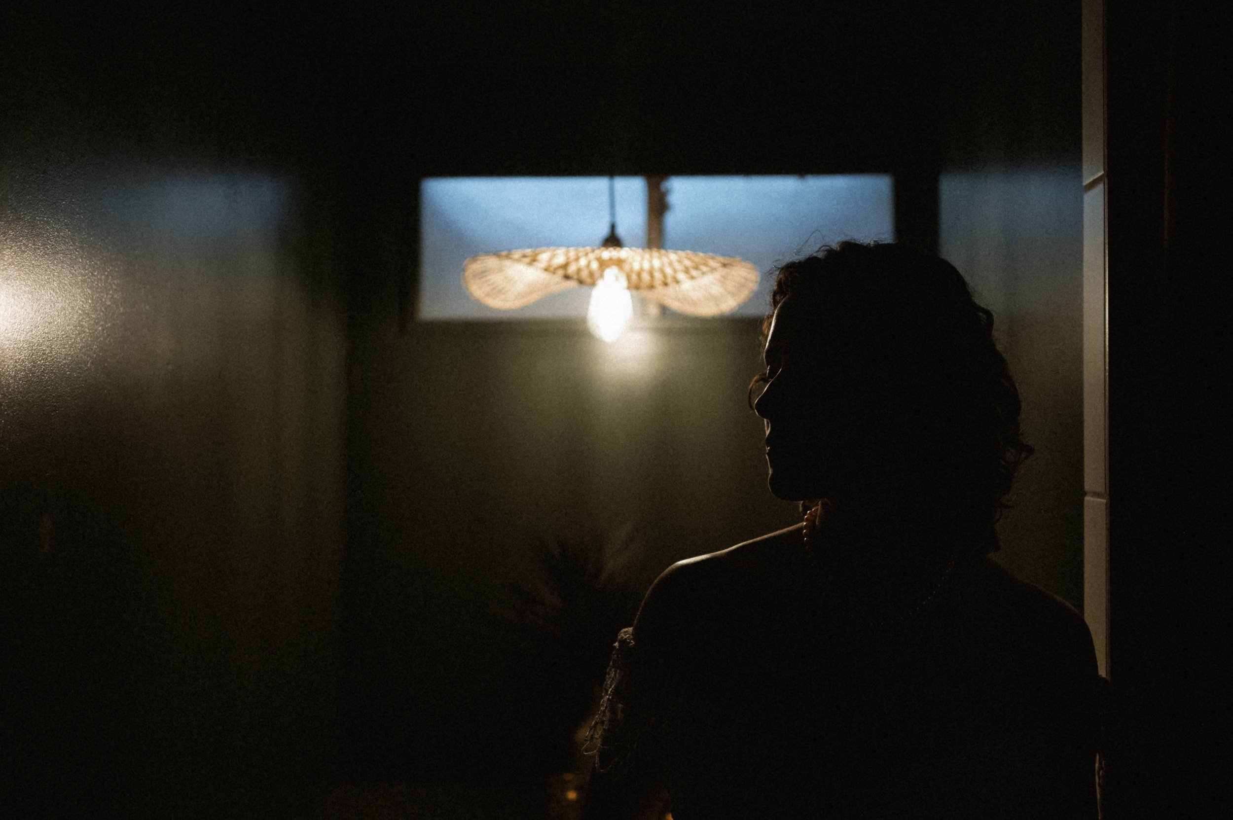 Eclectic bride portrait in peek-a-boo waist gown at Ember Studios wedding photographer venue