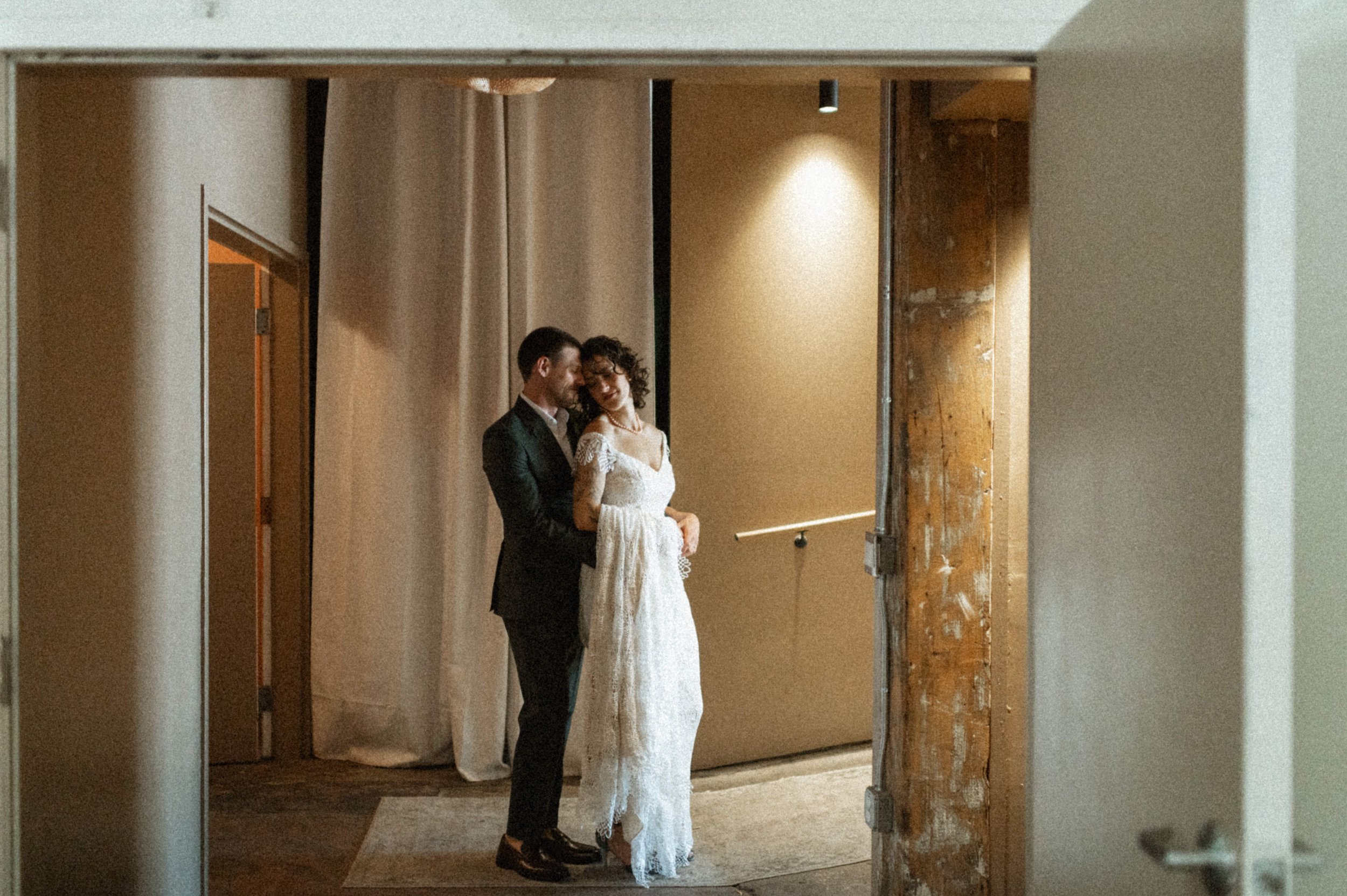 Modern art deco-inspired couple portrait inside Ember's eclectic industrial venue
