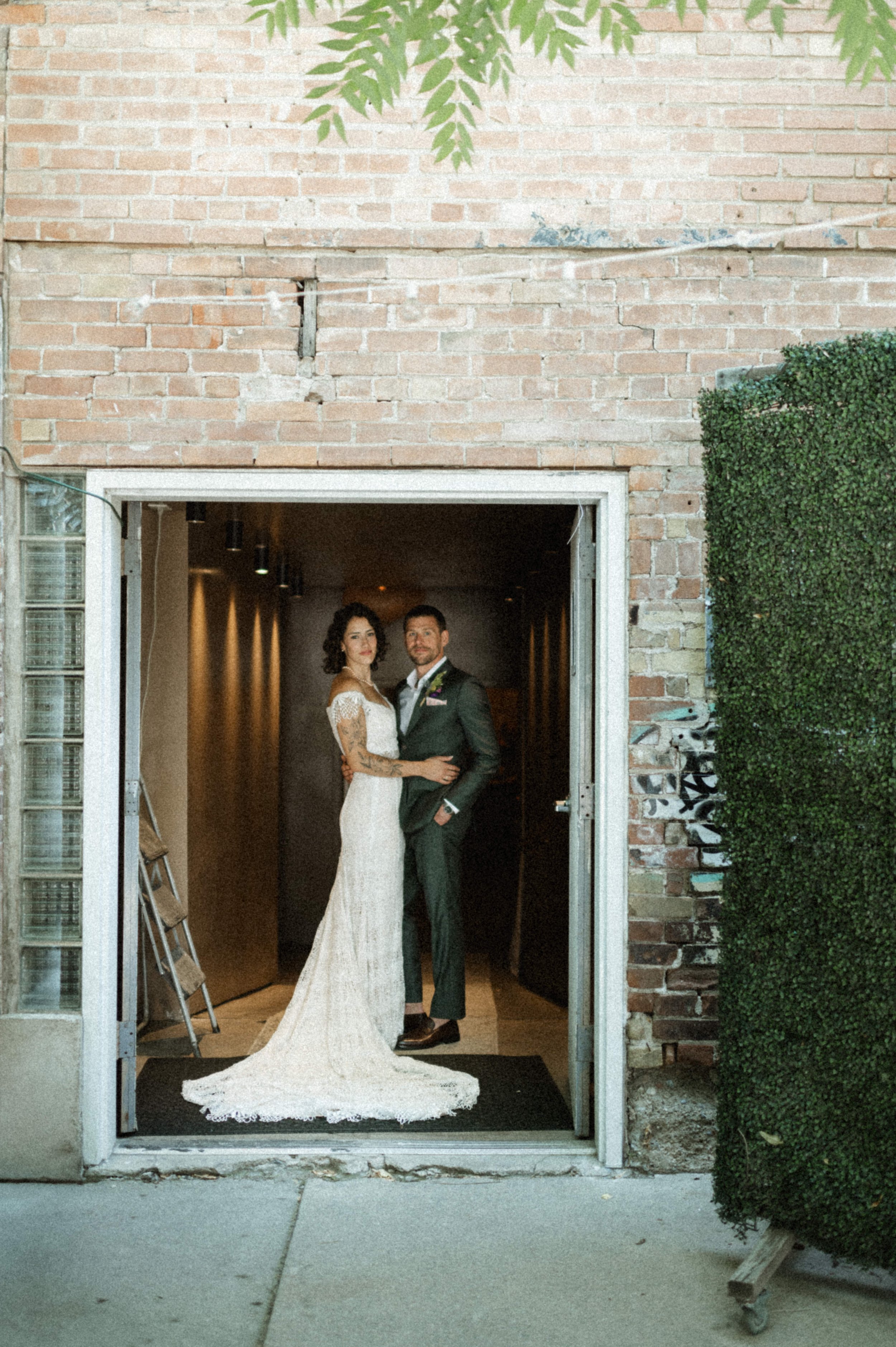 Modern art deco-inspired couple portrait inside Ember's eclectic industrial venue