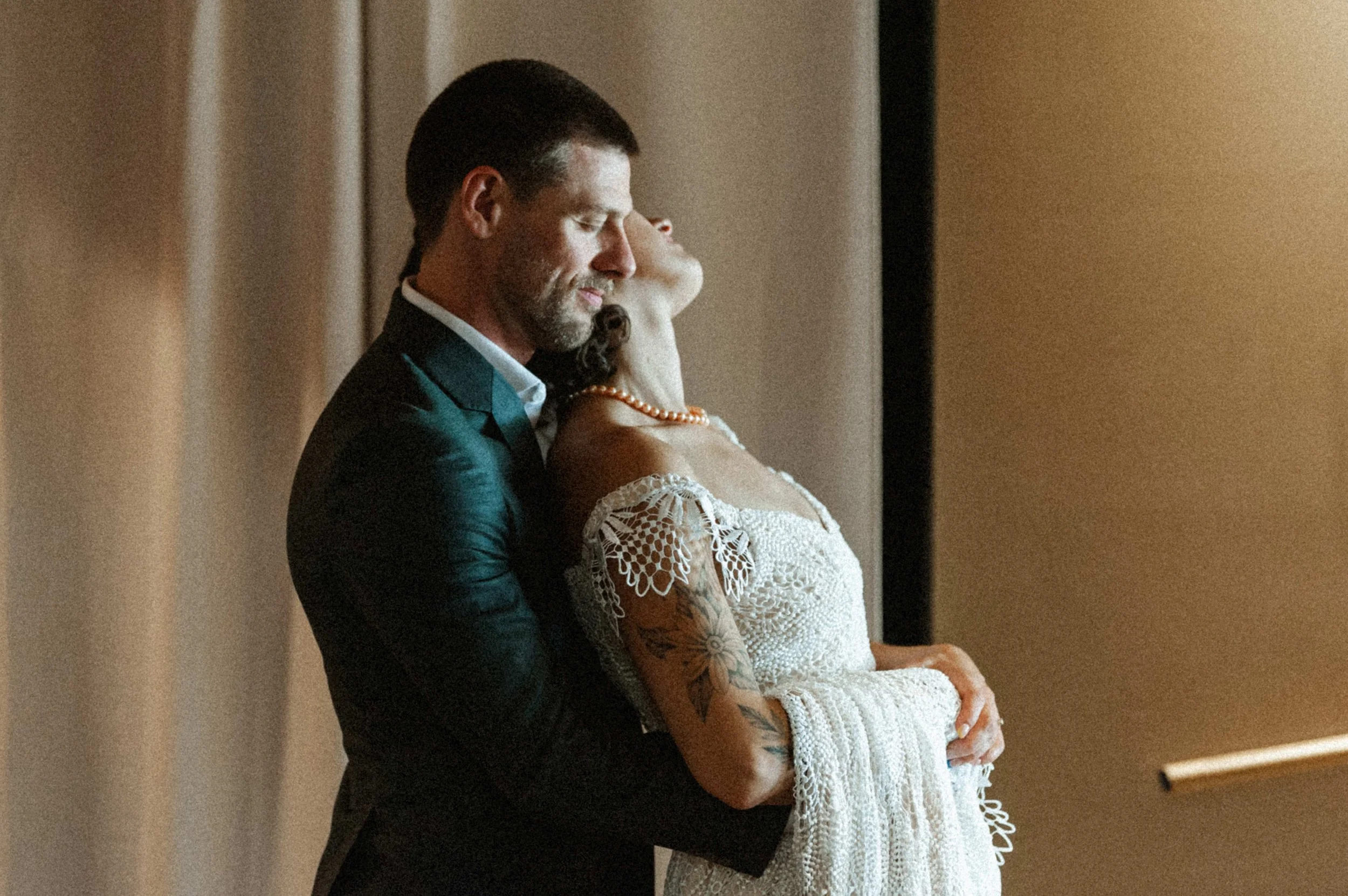 Modern art deco-inspired couple portrait inside Ember's eclectic industrial venue