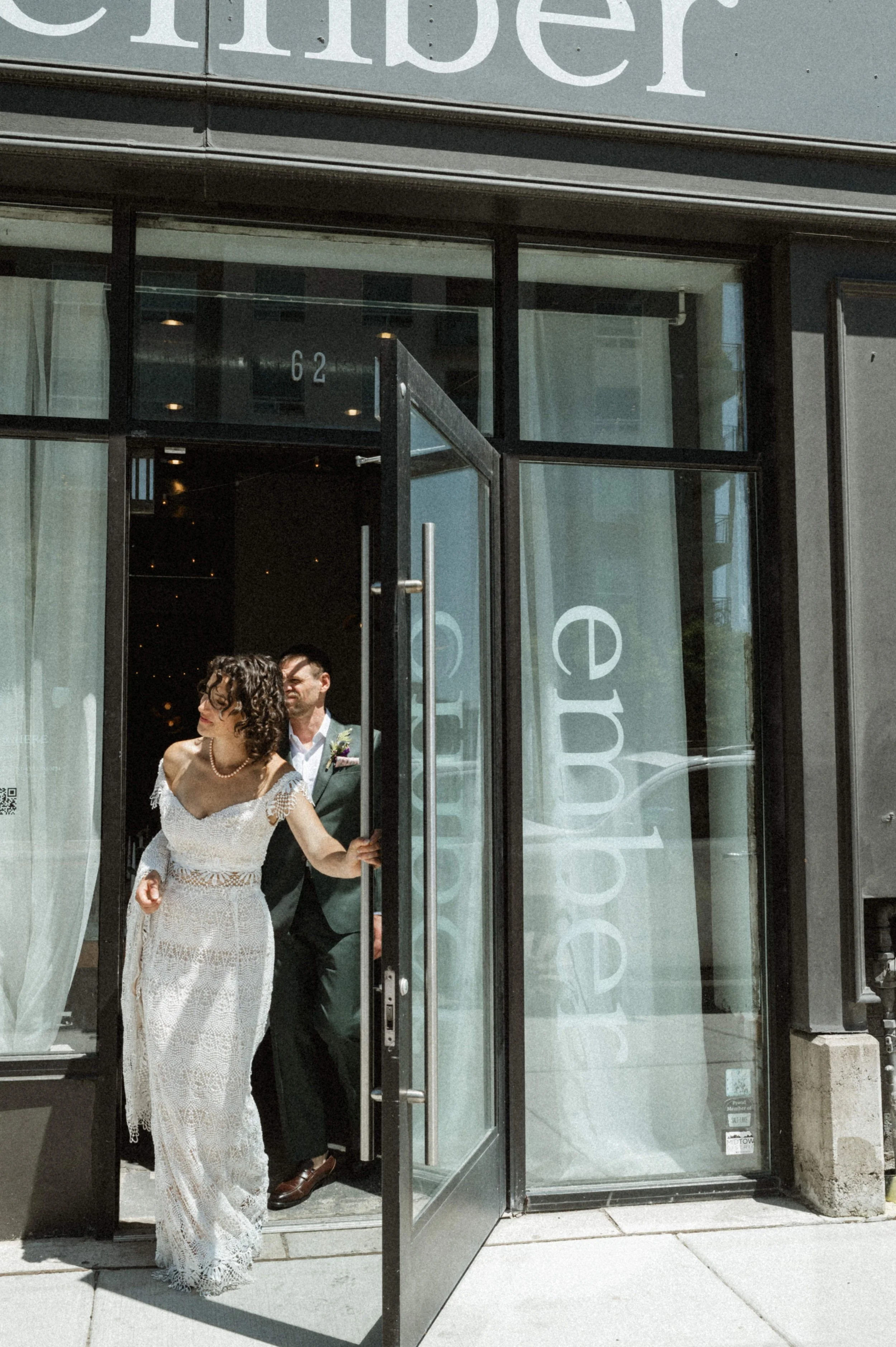Bride and groom portrait against industrial brick backdrop at Ember, downtown Salt Lake City
