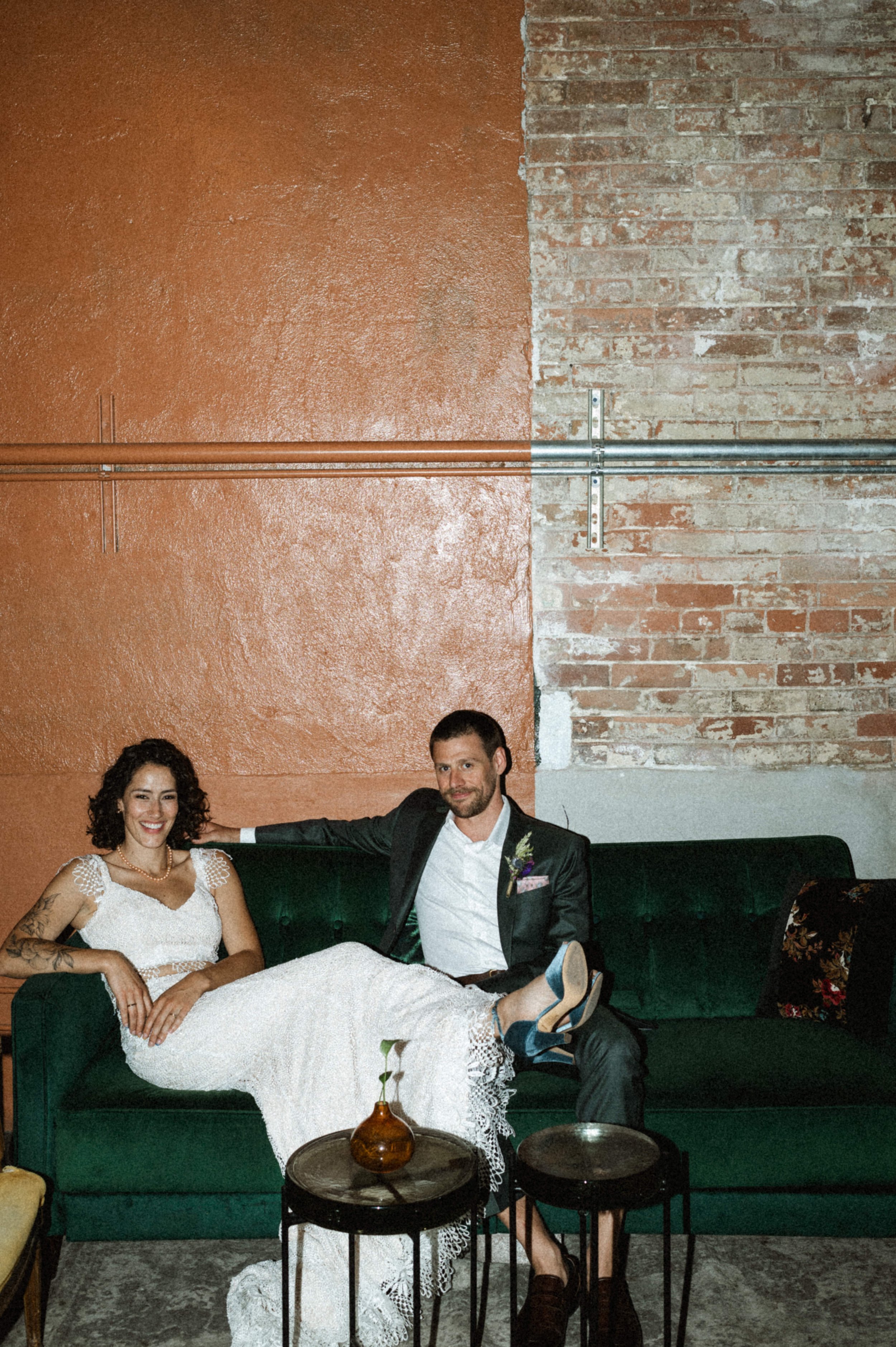 Bride and groom portrait against industrial brick backdrop at Ember, downtown Salt Lake City