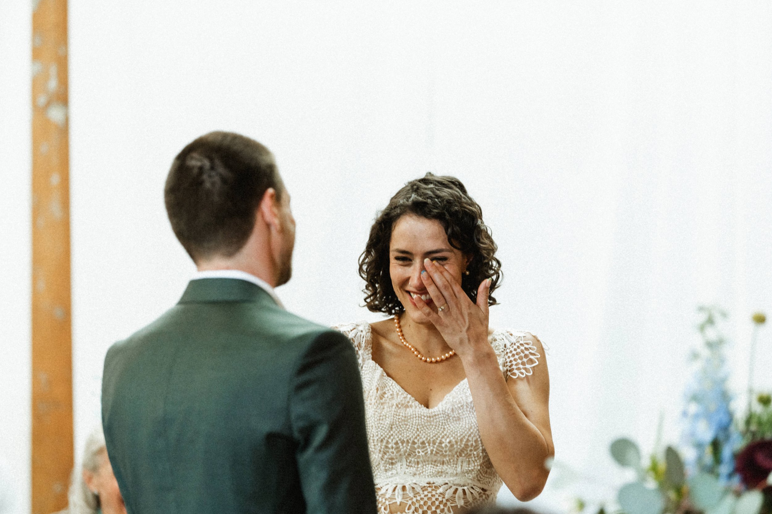 Eclectic modern wedding ceremony setup with exposed brick at Ember Studios