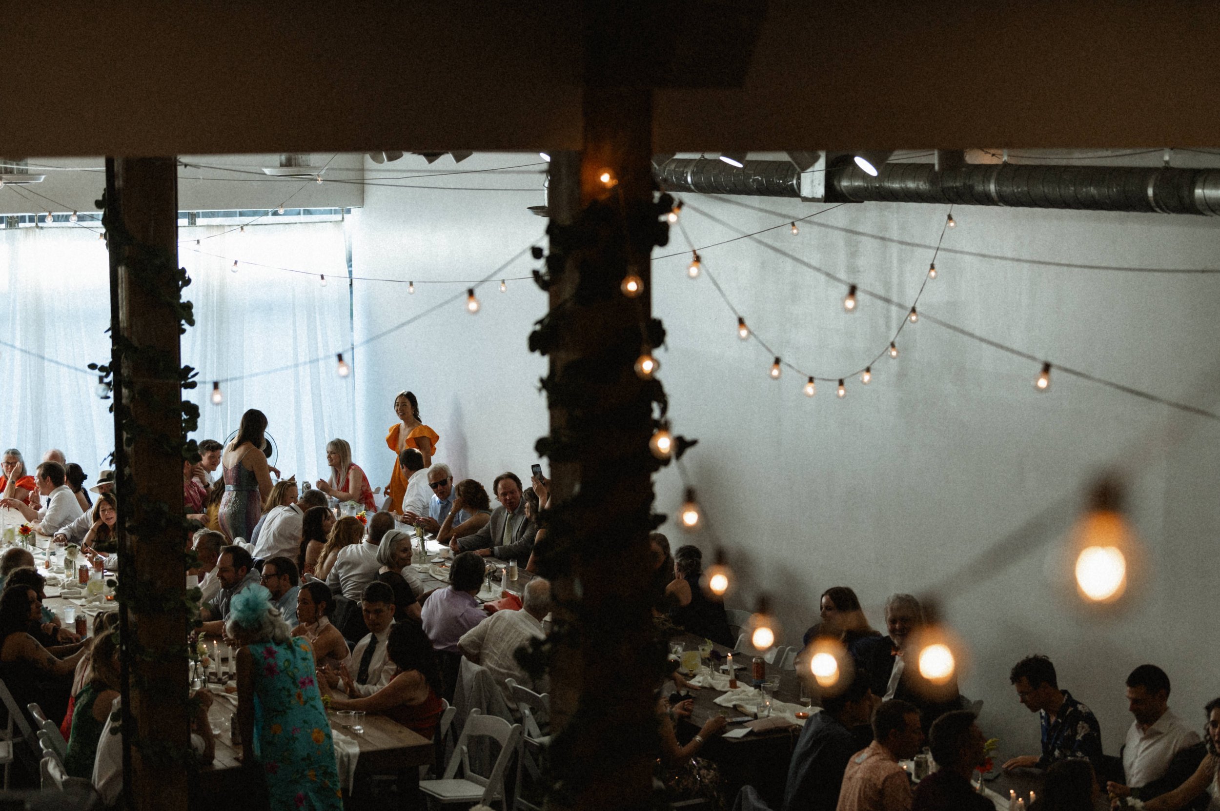 Art deco reception decor against raw brick walls at Ember wedding venue