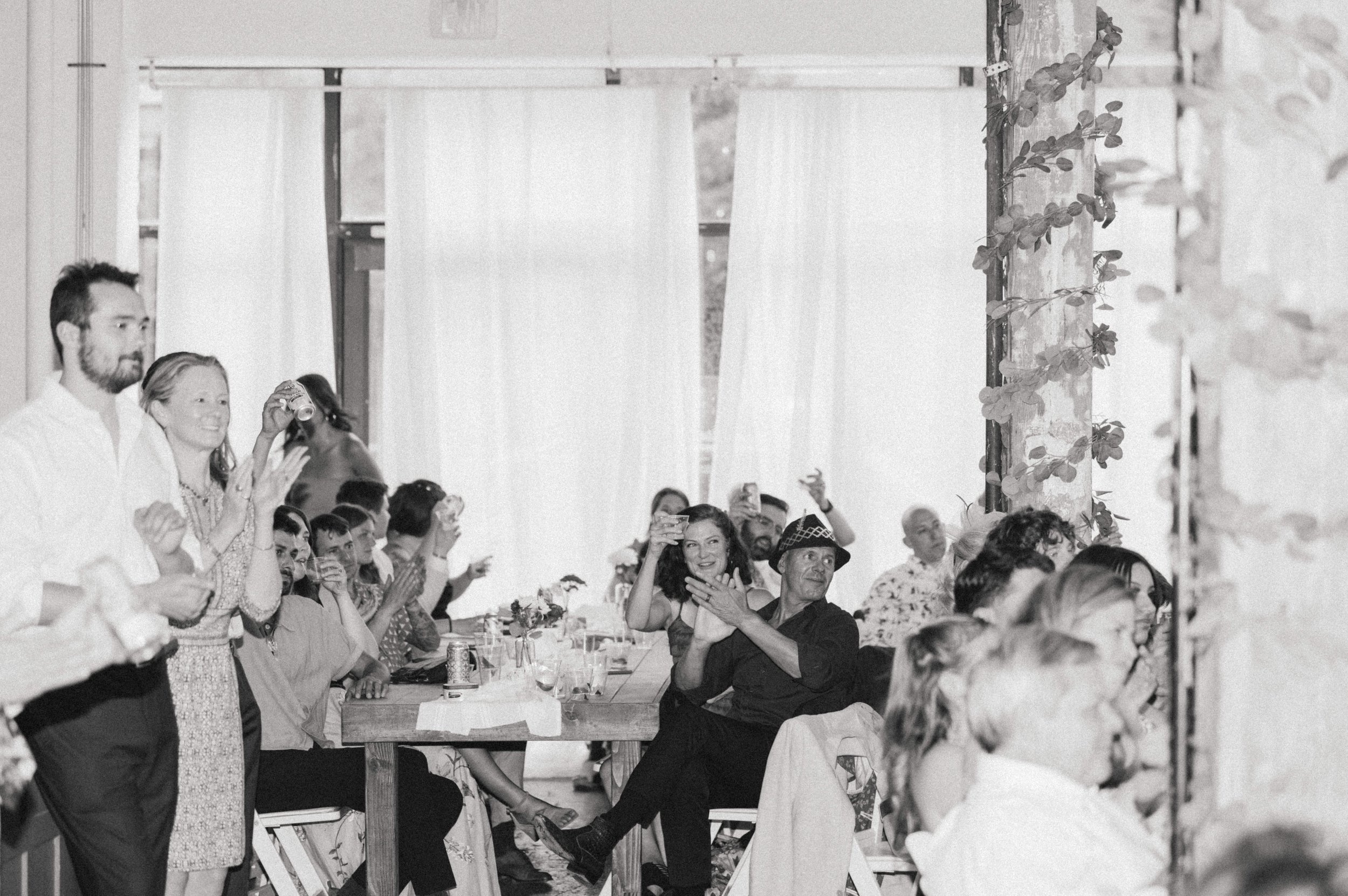 Art deco reception decor against raw brick walls at Ember wedding venue