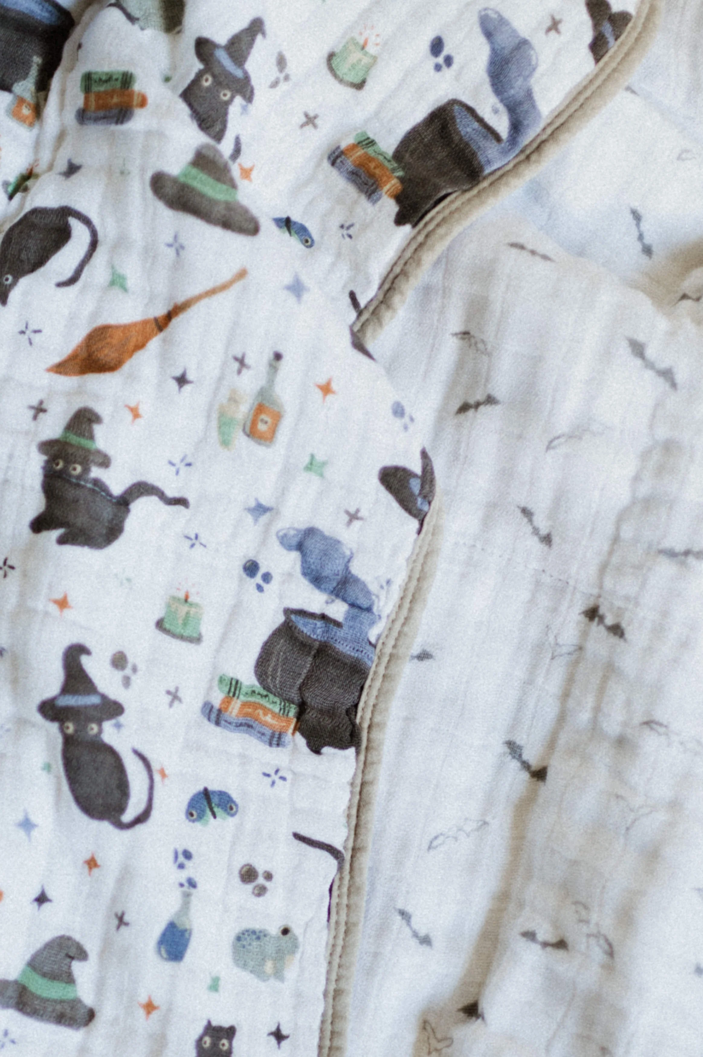 Professional product photography of organic cotton muslin Halloween print quilt