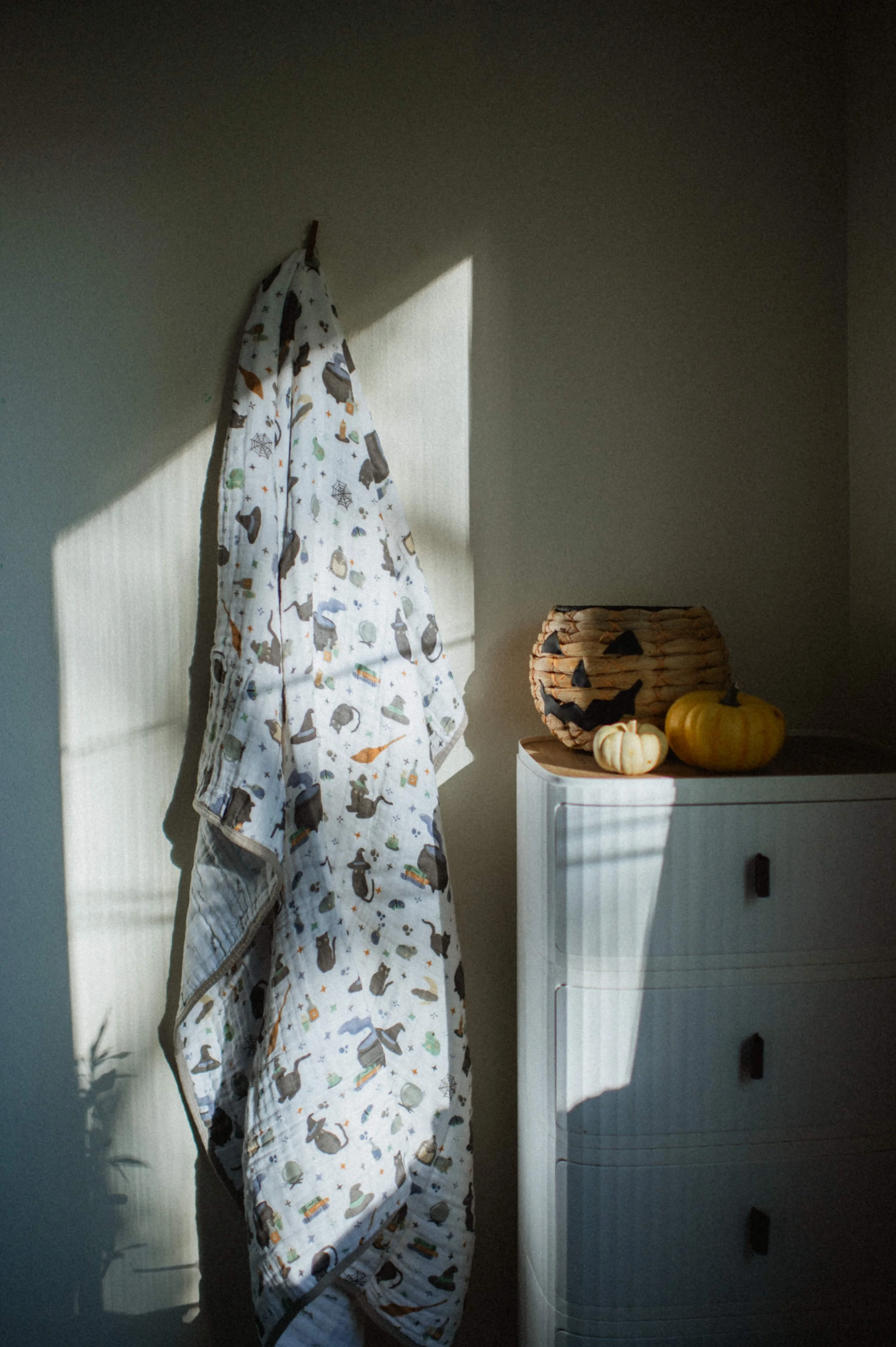 Professional product photography of organic cotton muslin Halloween print quilt