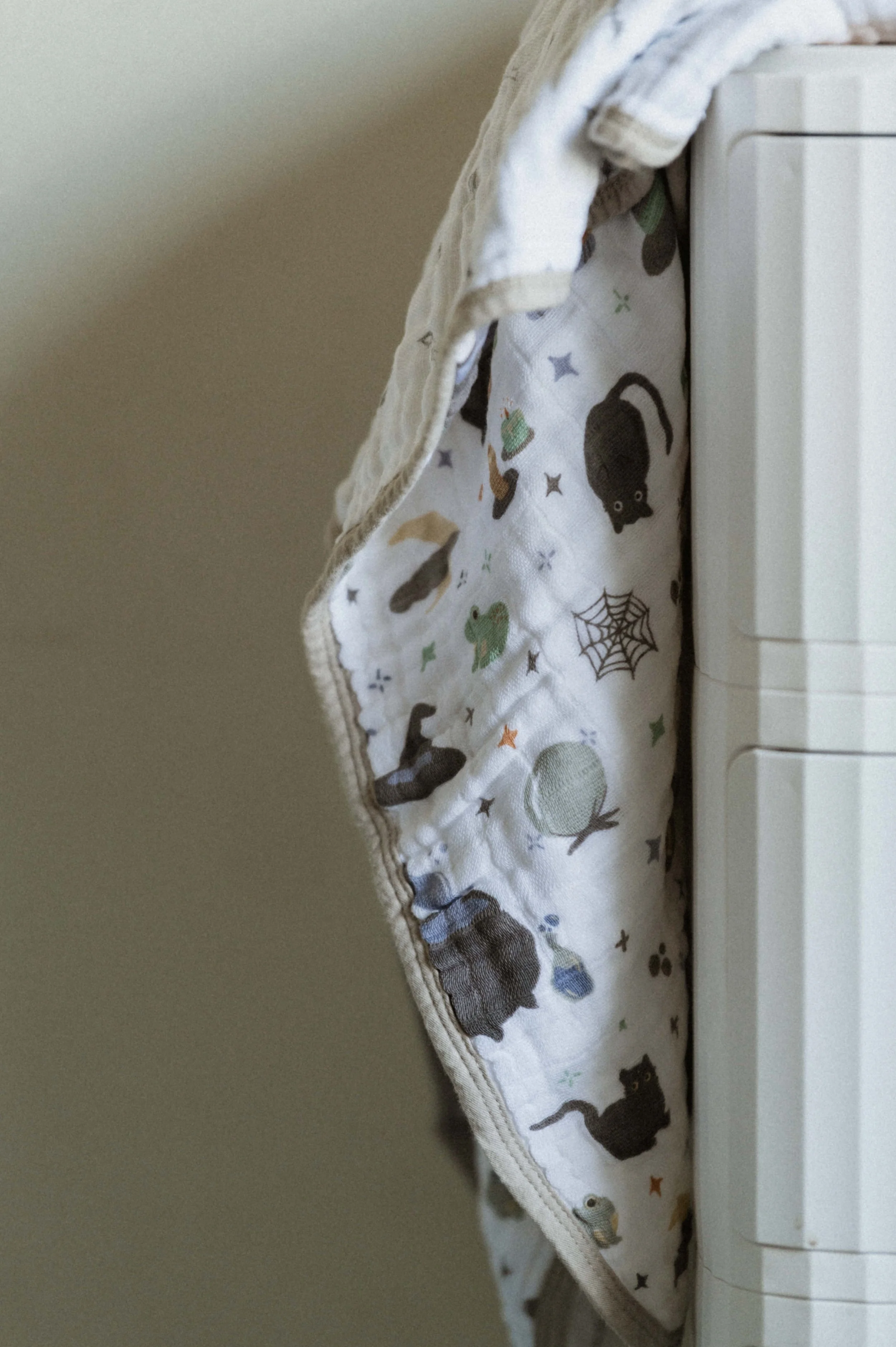 Halloween baby blanket photographer Utah styling Little Unicorn seasonal swaddle flat lay