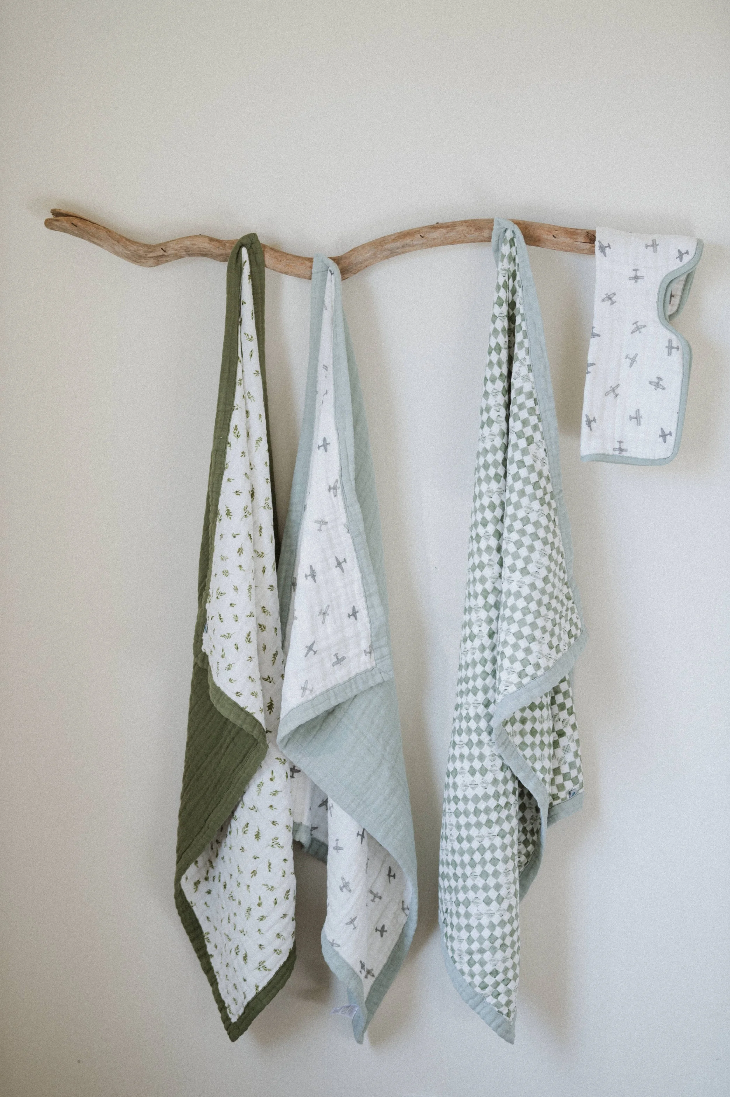 organic clean earthy product photography blankets hanging on wooden branch