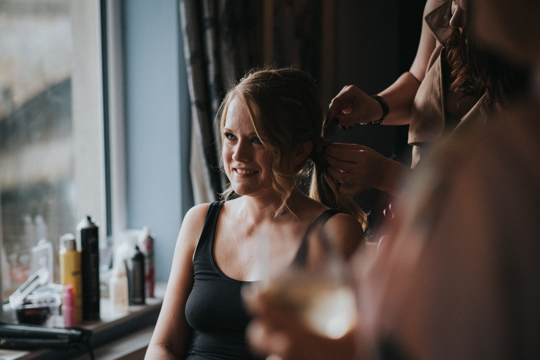 Candid unposed documentary wedding photography image of a bride getting ready