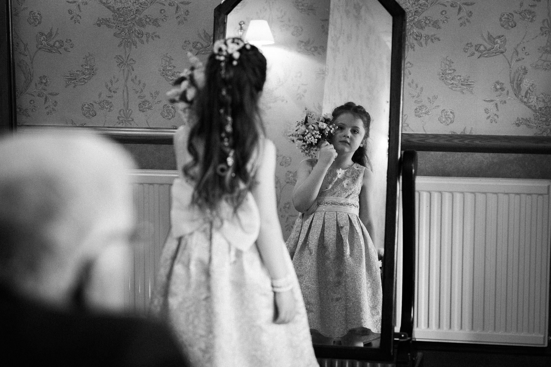 Cheshire Wedding Photojournalism - Bridesmaid looking in mirror