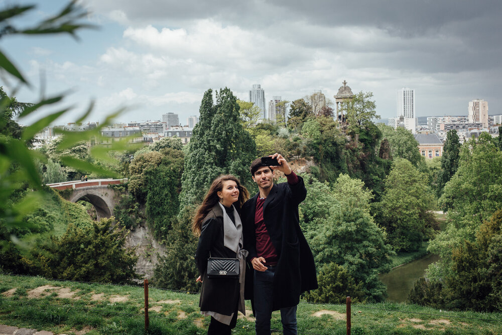  Couple taking a selfie in the park Les Buttes Chaumont, on May 5, 2019 in Paris, France.(Photo by Cyril Marcilhacy/For The Washington Post) 
