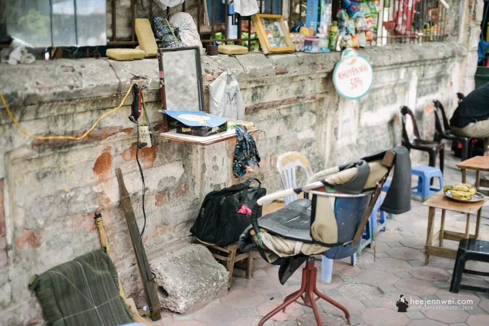 Barber by the sidewalk.