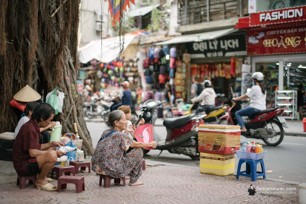 Lowered plastic stool, sunflower seeds and tea - the Vietnamese way of pass time.