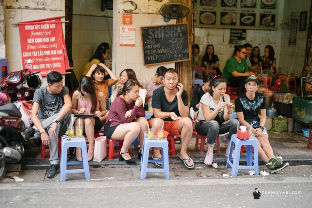 Restaurant by the sidewalk.