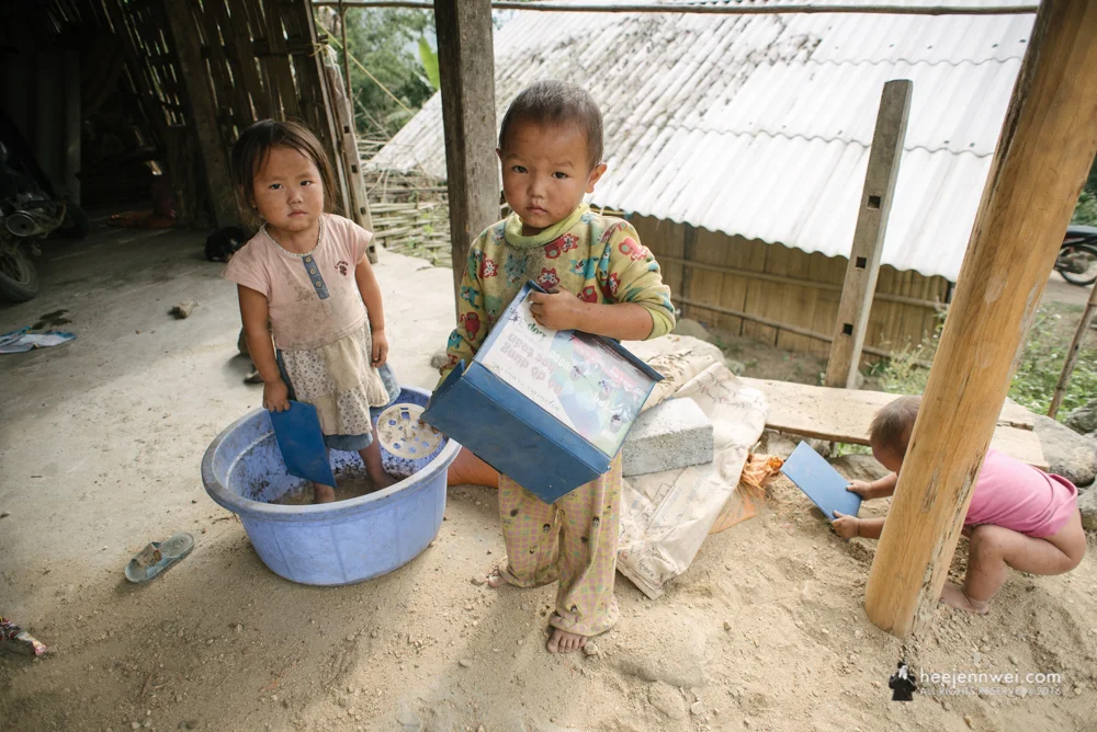 Crossing the Muong Hoa River up to the mountain is where Su Pan Village located, often being refer as "mountainous commune". Occupying the highland on the east side about 17km away from Sapa town. Kids of Red Zao Hill Tribe passing their time playing with sand under the rudimentary house built on rocky farmland.