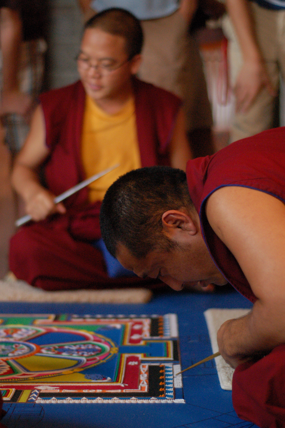   Monks from the Drepong Gomang Monastery in India create a mandala of compassion during the Sacred Arts Festival in 2009.  