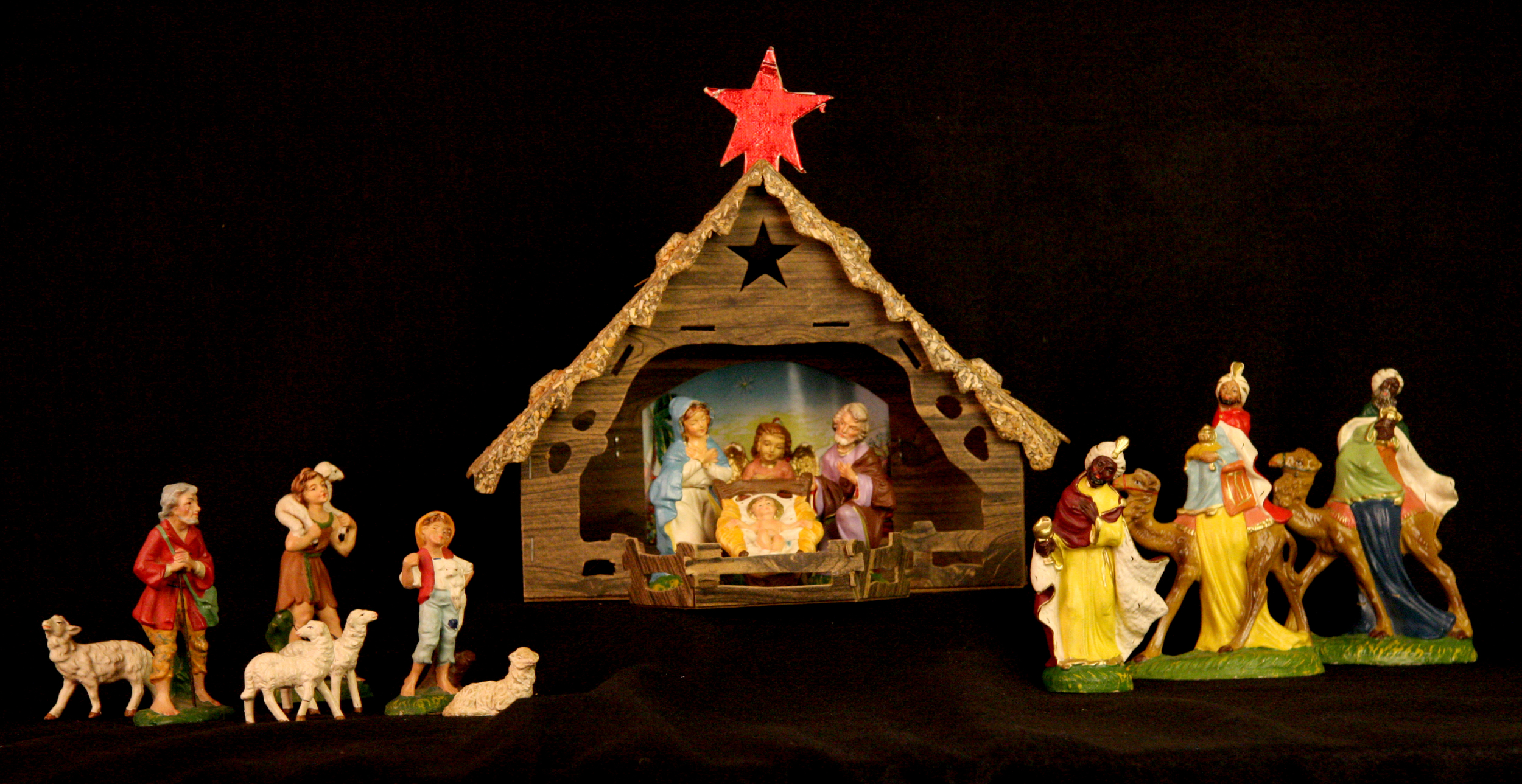 Papier-mache Nativity. Italy (figures), USA (cardboard stable). During the 1950s and 60s, many American families purchased inexpensive Nativity sets like this one at five-and-dime stores like Woolworth’s, W.T. Grant, and G.C. Murphy. (Several of the figures in this set have a Murphy’s sticker on the base.) Hand painted in Italy, the figures are hollow, with thin papier-mache walls. Most starter sets included the Holy Family, the three wise men, an ox and a donkey, but many different kinds of figures could be bought individually. Nativity sets owned by families were often assembled over a period of years, resulting in figures of different sizes, materials, and countries of origin. Collection of Glencairn Museum.