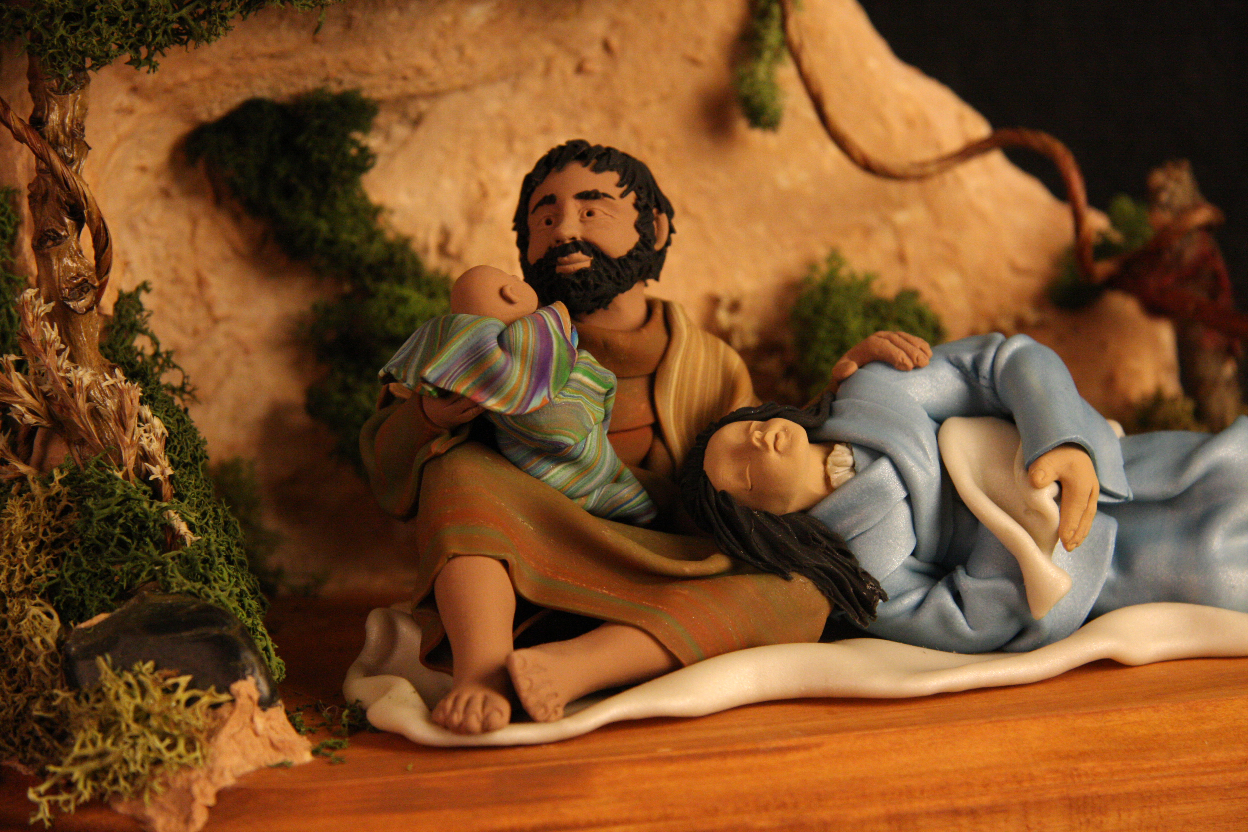 Nativity scene by Judy Gibson King, USA, 2007. Handmade from polymer clay, wood, and natural materials. King began making religious figures out of polymer clay as a form of private meditation and prayer, but her work has since become a full-time occupation. This Nativity has a contemporary feel; Mary lies asleep with her head in Joseph’s lap while he holds the baby Jesus. Collection of Glencairn Museum, gift of Alan and Mary Liz Pomeroy.
