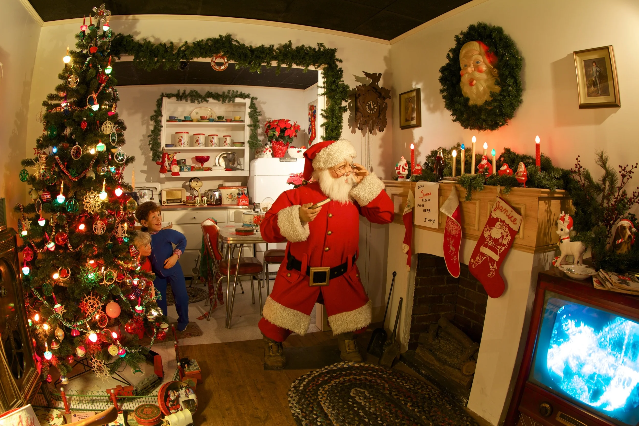 Figure 7: The National Christmas Center’s exhibit 1950’s Night Before Christmas is a life-sized reproduction of a famous vintage Coca-Cola advertisement. Two children are shown spying on Santa Claus late on Christmas Eve. A bottle of Coke has been left on the mantel for Santa.