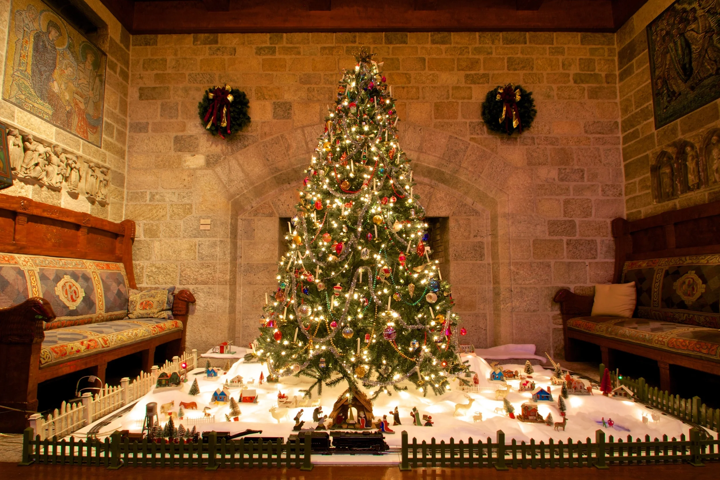 Figure 1: Glencairn’s vintage Christmas tree ornaments and Christmas village decorations were donated in 2011 by Brother Bob Reinke. Brother Bob, whose special love of Christmas has earned him the nickname “Brother Christmas,” joined the Brothers of the Poor of St. Francis in 1958. The Nativity scene beneath the tree this year was handmade in the 1930s by a family in eastern Germany, and was part of the village scene beneath their Christmas tree. The operating 1950s Lionel toy train was donated by Louise Chardos of Hoboken, New Jersey. Her brothers Jim, Steve and Hank collected the train and accessories as boys, setting them up annually beneath the family’s Christmas tree.