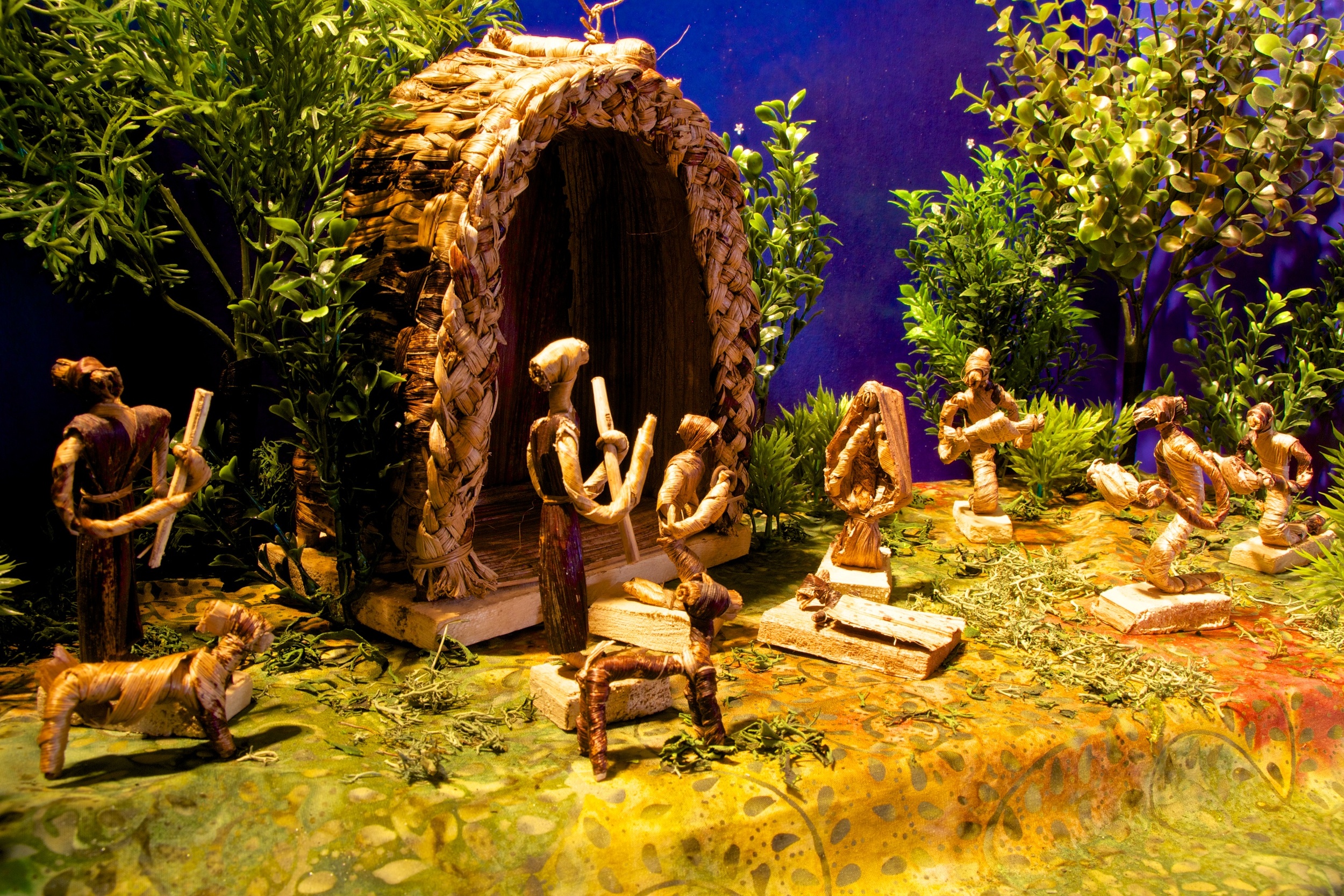 Figure 3: The figures and stable in this Nativity from the Republic of Uganda were made from wire frames wrapped with dried banana leaves. Mary and Joseph have their hands folded in prayer. The kneeling wise men present their gifts to the Christ Child.