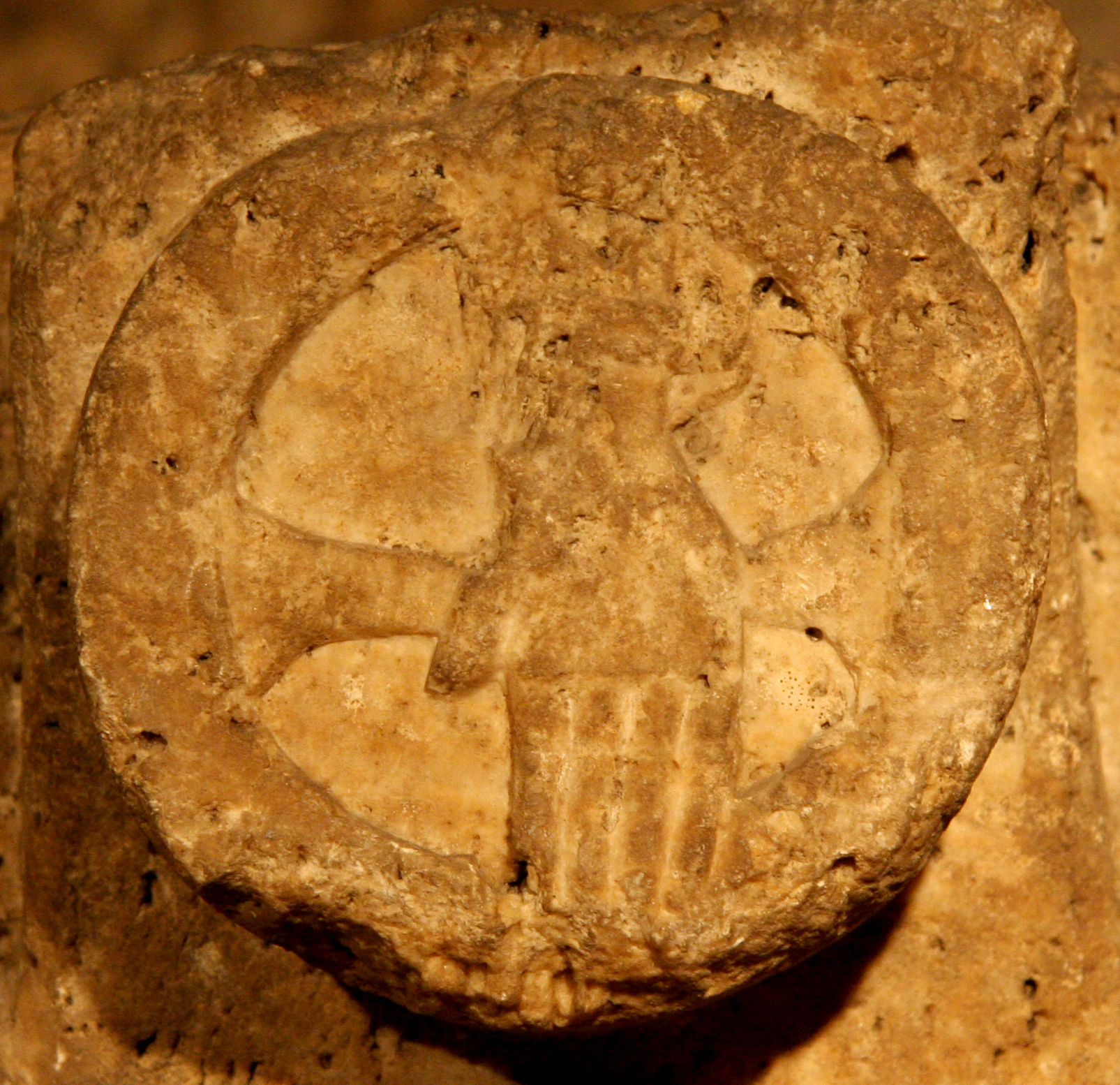 Figure 5: The hand of God, reaching down, enveloped in a halo inscribed with the cross.