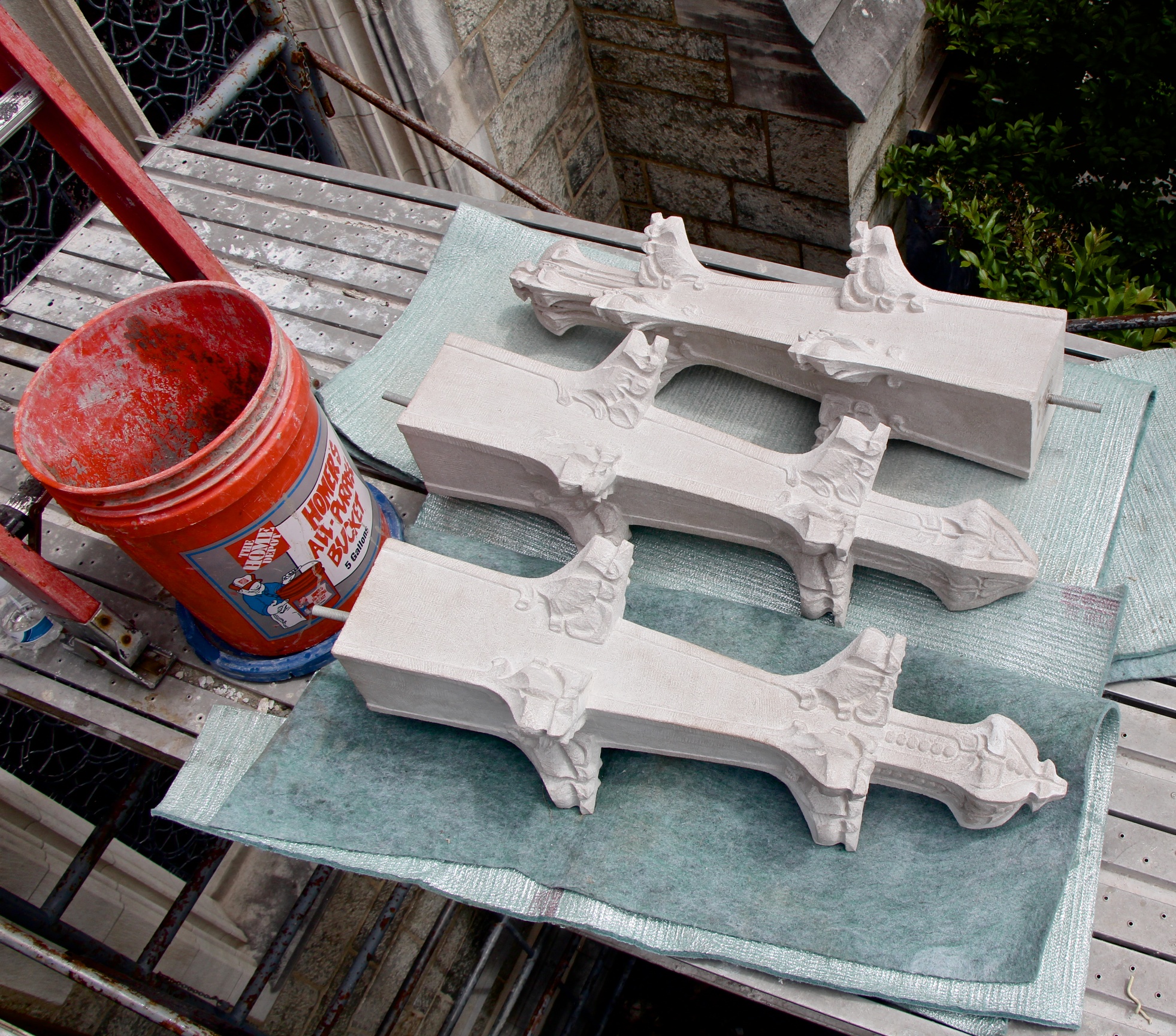 Figure 7: Three completed limestone finials ready for installation above the south entry of Bryn Athyn Cathedral. These will replace the original, badly degraded finials.