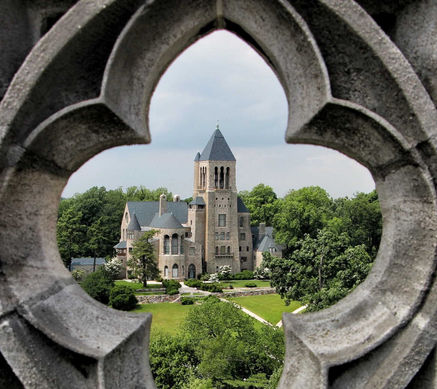 Glencairn viewed through one of the quatrefoils at the top of Bryn Athyn Cathedral.
