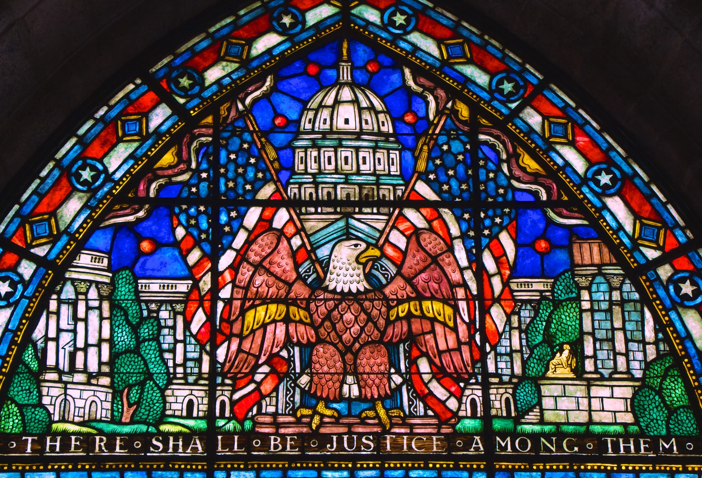 This window in Glencairn's upper hall, made in Bryn Athyn's glass studio and factory, illustrates the balance of power between the branches of the US Federal Government.