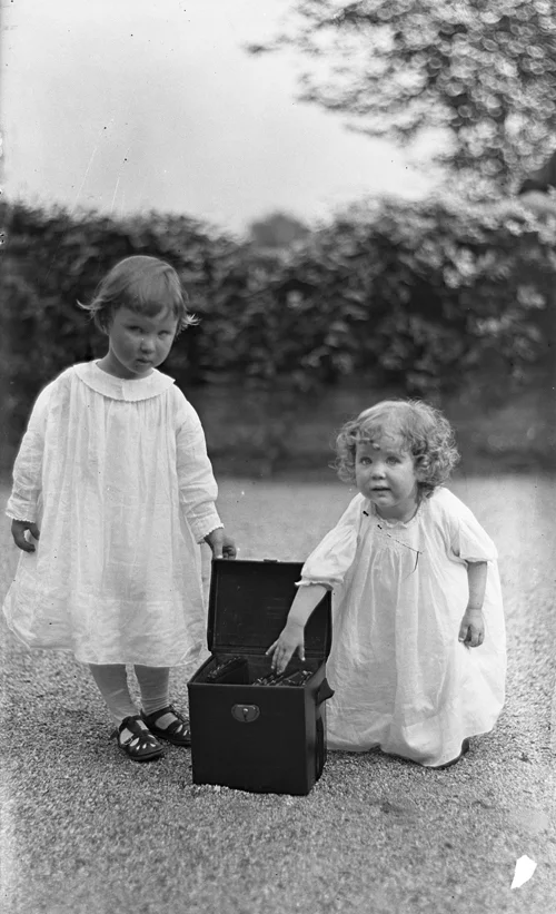 Nathan and Gabriele Pitcairn, circa 1915, Posing with Their Father's Camera Box