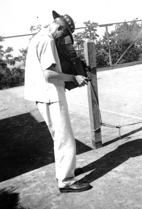 Raymond Pitcairn, circa 1939, with his camera on the Glen Tonche tennis court. Glen Tonche, the Pitcairns' summer home in the Catskills, was one of his favorite spots for taking family photographs. Photograph courtesy of Jennifer Gardner.