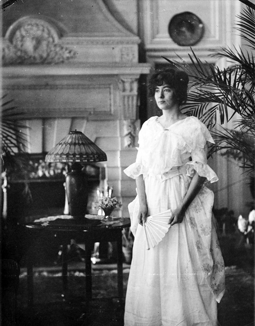 Volita Wells Poses in Costume in Cairnwood's Parlor Hall