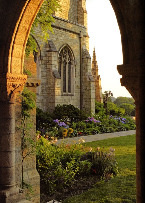 A view of the Cathedral gardens looking out of the cloister arcade toward the corner of the nave (from page 32 of Bryn Athyn Cathedral: The Building of a Church ). The west porch is just out of sight. Photograph by Hal Conroy.