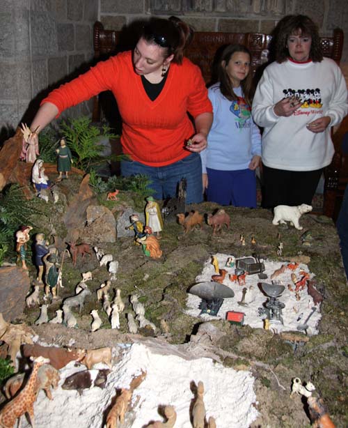 At the front of the Nativity is a small “sandbox” filled with toys, a feature that had been part of the putz when it was owned by the Morris family.