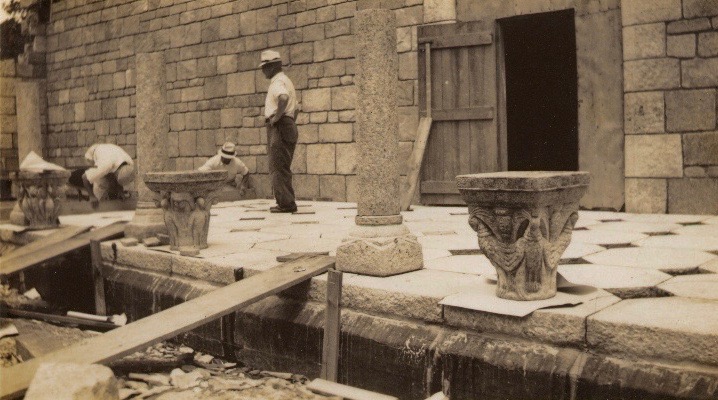 Figure 6: Glencairn's cloister during construction. The temporary wooden door in the photograph is on the east side of the cloister; today this is an ornate copper door providing entry to the Great Hall. Glencairn Museum Archives.