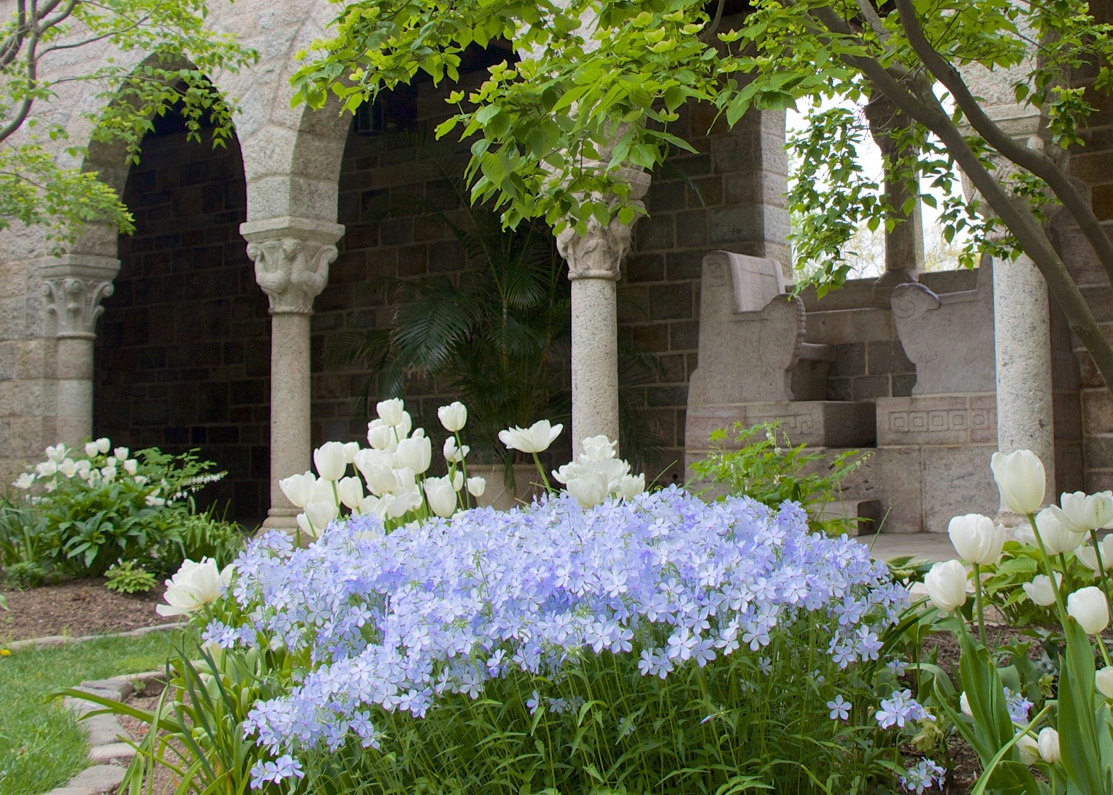 Figure 10: Late spring gardens in bloom in Glencairn's cloister.