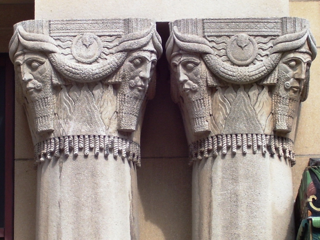 Figure 8: Heads inspired by Neo-Assyrian colossal bulls (and iconographically similar to the genies at Glencairn) on the Pythian Temple in New York City, a lodge for members of the fraternal organization The Knights of Pythias. The art deco building drew heavily from on-trend Egyptian and Assyrian artistic motifs. (Photo by Beyond My Ken, via Wikimedia Commons.)